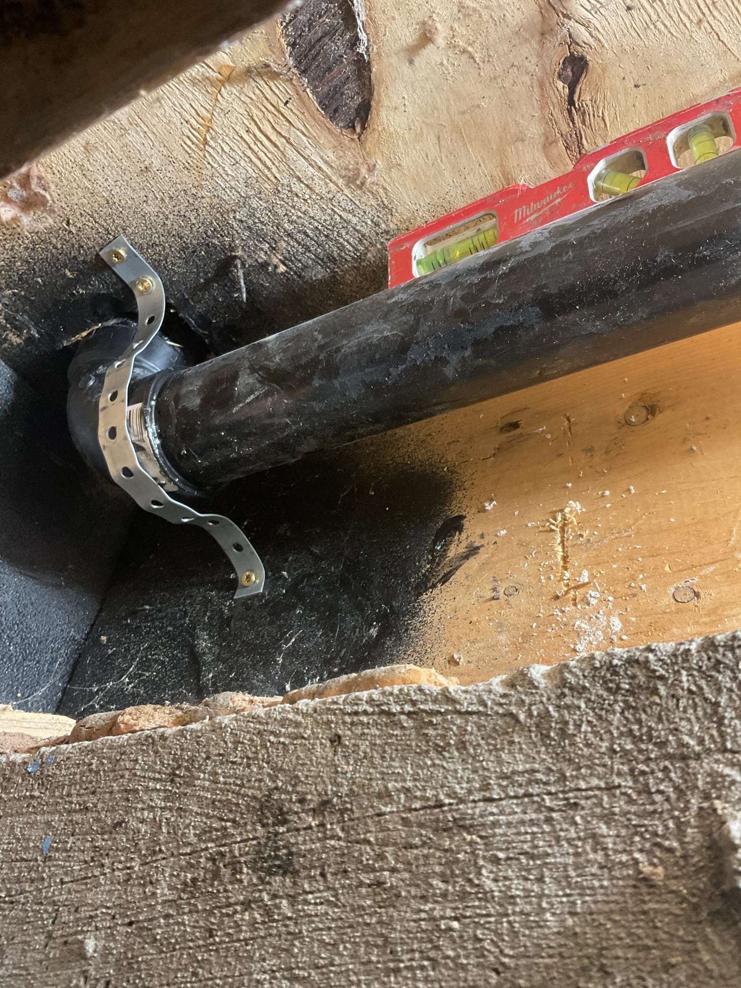 Kitchen Drain Line Repair:
-A section of the kitchen drain line was replaced due to ongoing leaks and repeated clogging issues. The existing 2" ABS drain exhibited significant back-pitch and had been previously patched with PVC, which failed to bond correctly and resulted in additional leakage.
-Approximately 20 feet of Sheetrock was removed to access the affected piping. All insulation within the repair area was removed and stored in the garage for reinstallation. Only one pipe hanger was found supporting this length of pipe, with the beam serving as the only additional structural support.
-Twenty feet of ABS piping was cut out and removed. Sections of the line were found to be completely filled with standing water and food grease. -New blocking was installed every four feet to properly support the replacement pipe and ensure correct pitch.
-The new line was tied into the existing pipe coming through the floor using a standard 90° fitting due to pitch limitations. The replacement sect