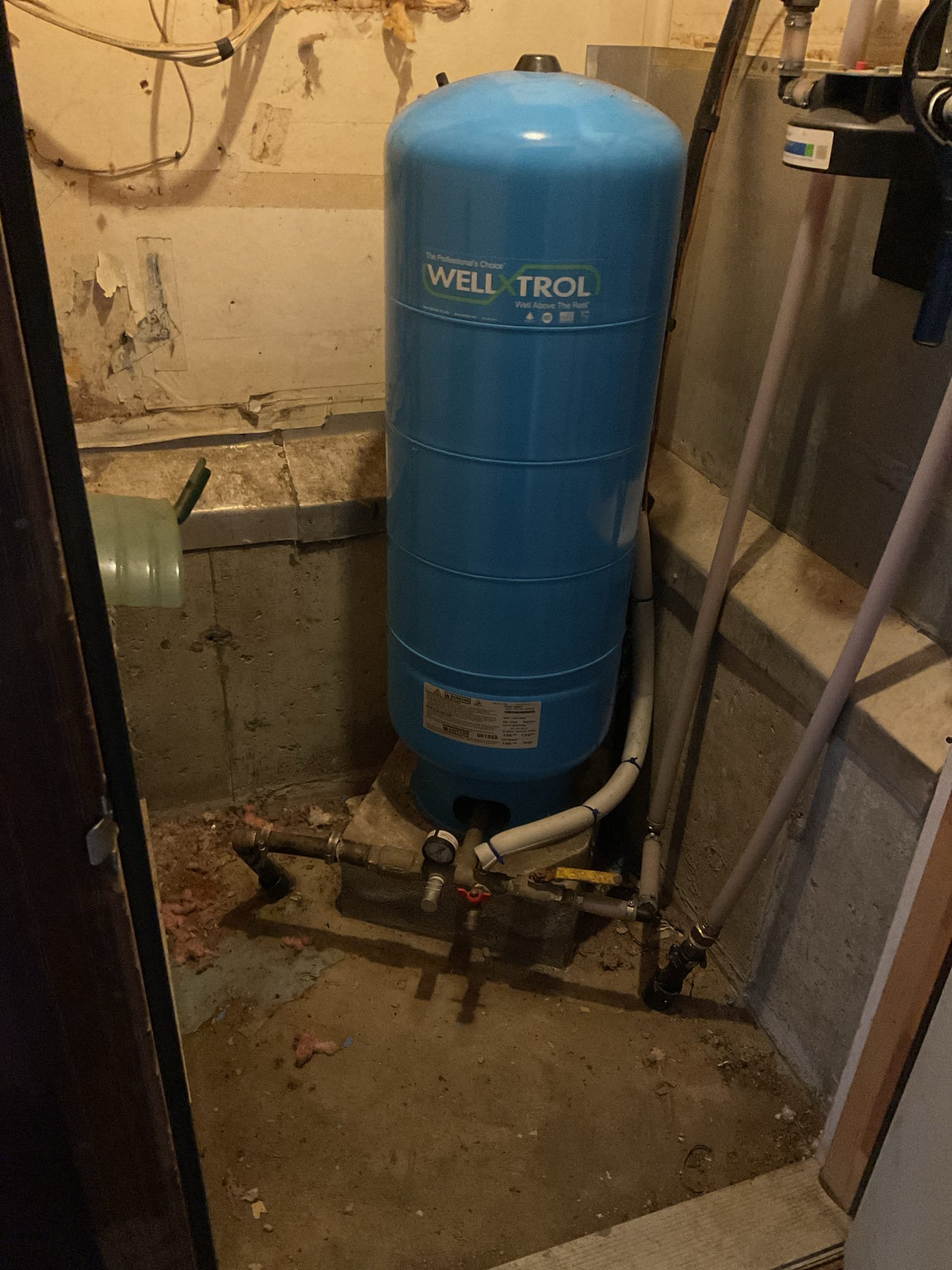 A full diagnostic assessment was performed to determine the source of the leak. Prior to inspection, approximately 1/2" of standing water was extracted from the crawl space; water had been pooling around the leak location and dripping through the insulation near the ductwork. All accessible water was removed and a fan was used to assist with drying; due to the size of the affected area, some residual moisture remained, but the majority was eliminated.
Two sections of 1/2" trailer PEX were found to be leaking due to deterioration and rodent-damaged fittings. The damaged Tee fitting and affected pipe sections were cut out and replaced with new hot and cold PEX lines, transitioning to the existing polybutylene piping using appropriate adapters. The water system was turned back on and tested, confirming no leaks were present at the repair points. The homeowner was advised that the water-damaged insulation should be replaced and properly insulated to help protect the pipework.