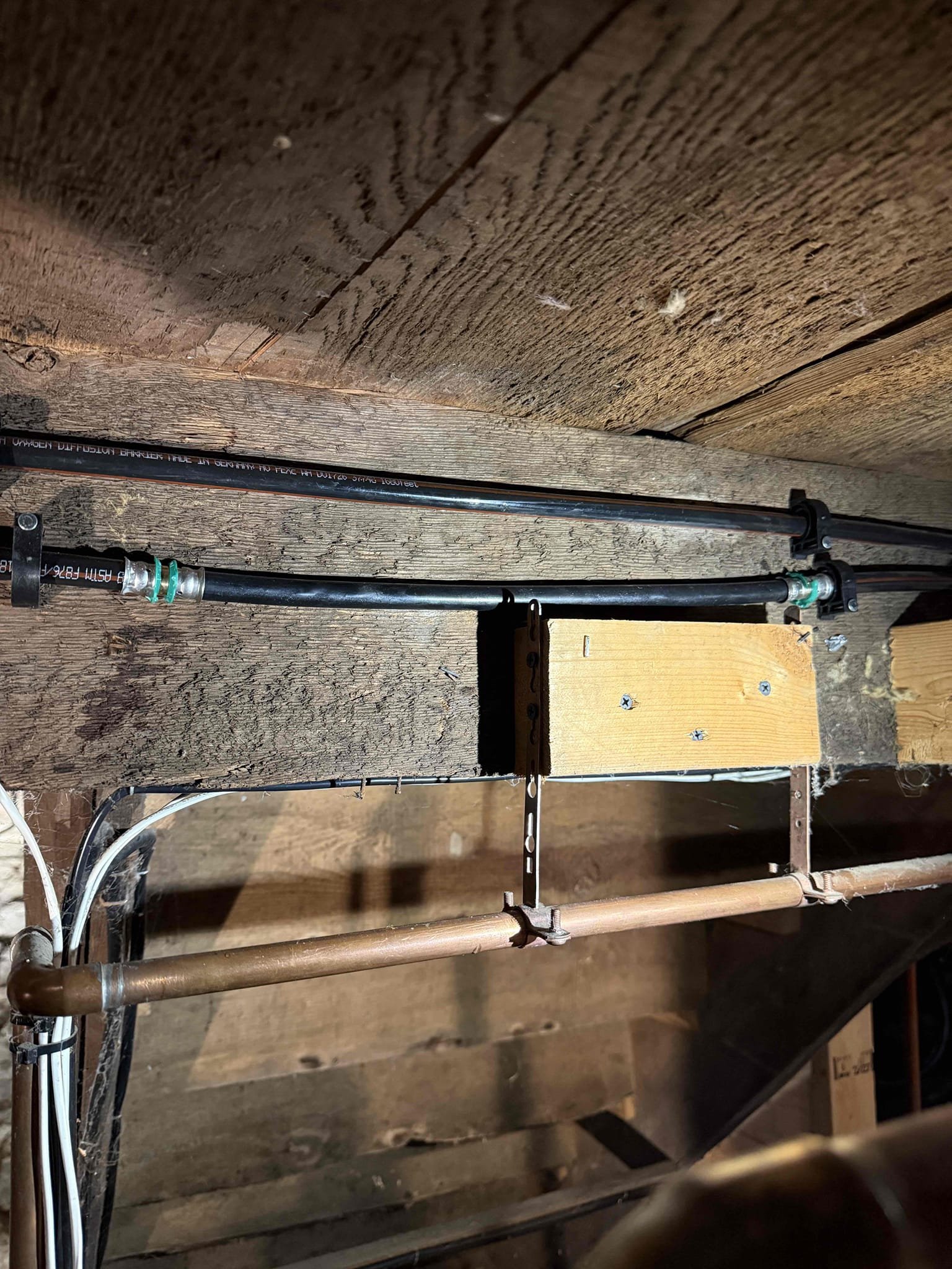 Upon inspection, the customer reported that while insulating the piping, a staple had punctured the 3/8” PEX supply line. Although the customer had the zone shut off, the line continued to drip. With the customer’s approval, I replaced the damaged section with a new piece of PEX and installed two couplings. I also added two hangers to properly support the piping.

I then purged the zone; the radiant system contained a significant amount of air, but I was able to remove as much as possible. The system’s air vent should clear the remaining air.

At this time, the system is operating as expected.
