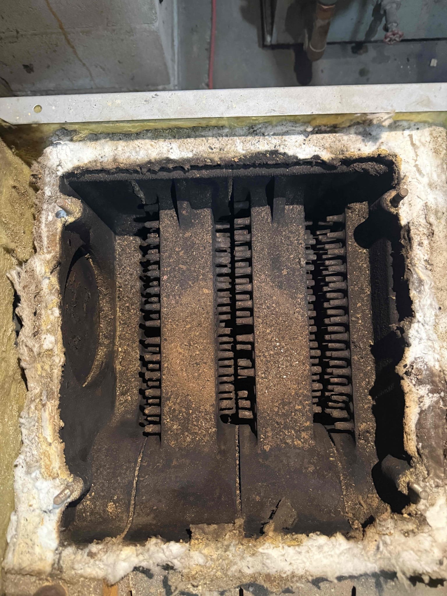 The customer reported that their oil boiler would run but would not stay lit. With the customer’s approval, I performed a full annual service, including replacing the nozzle and strainer, and brushing and vacuuming the boiler and smoke pipe. I also vacuumed the heat exchanger as thoroughly as possible; however, the boiler door cannot open fully due to the piping configuration.

During the inspection, I found the electrodes to be excessively worn and in need of replacement. With the customer’s approval, I installed new electrodes. I then performed a combustion test, draft test, and verified pump pressure and pump cut-off. I also checked all system safeties to ensure proper operation, including confirming that the boiler shuts off at high limit.

The boiler is now igniting and running properly, and all systems are operating as expected at this time.