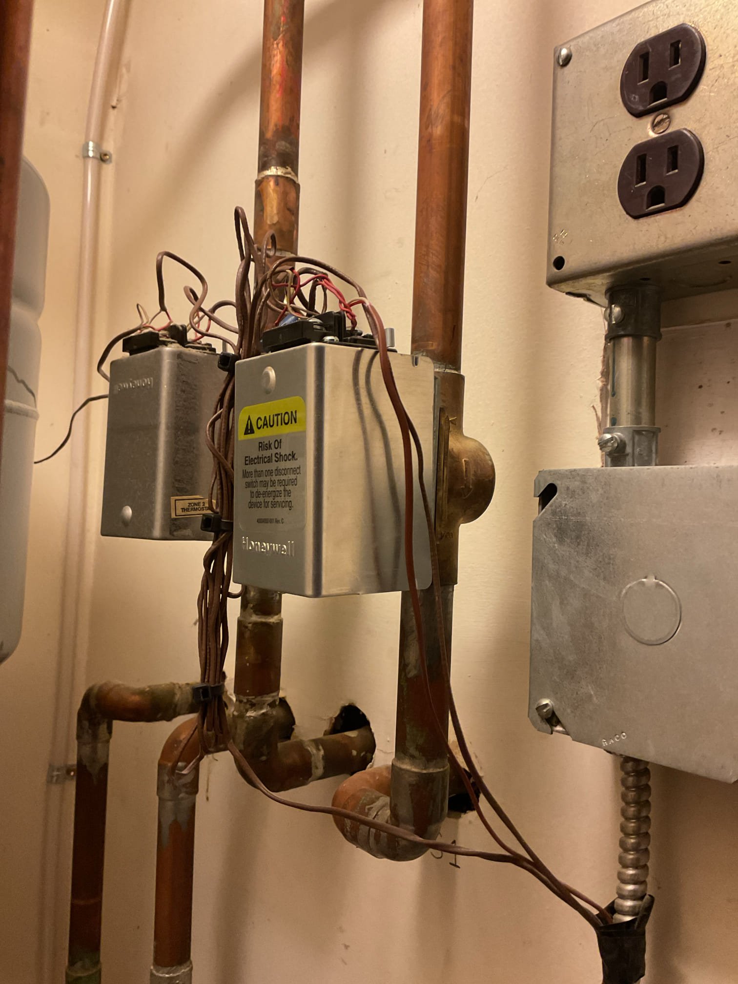 Arrived on site to diagnose no heat and loud buzzing sound. Upon our initial inspection we found that the powerhead to one of the zone valves had seized and needed to be replaced. We also noticed the circulator pump on the boiler was leaking out of the packing nut for the valve. We tightened that up with a wrench and the leak stopped. We then provided estimates to replace the powerhead and to replace the scale stopper filter. Only the powerhead replacement was accepted at this time.

We removed the old powerhead and installed the new one. We then wired up the new powerhead and tested operation. Both zones are now operable.

Thank you for your business!