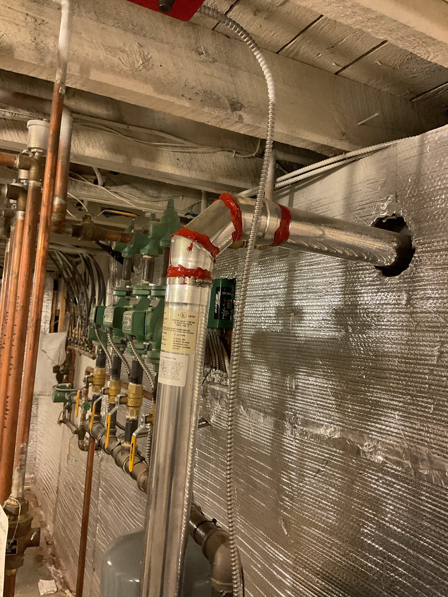 Arrived on site to perform an annual tune up on propane boiler. After our initial inspection, we provided an estimate to do the tune up as nothing obvious was found to be wrong. It was accepted.

We started by turning gas and power off to the unit to pull and clean the burners. Brushed them with a wire brush to get any rust buildup off. Inspected igniter. Was in good shape. We then put burners back and tested gas pressure. It was right at 10” w.c. Which is right where the boiler wants to be. We then performed a combustion analysis and checked for CO leaks on the venting. Combustion analysis was fine. O2 and CO2 were at fairly similar levels. We did find that the venting had some spots where the piping had cracked a little. We applied high temp silicone to all the joints on the venting to seal them up. CO leak is no longer present. System is operating properly at this time.

Due to the age and condition of the heat exchanger, we recommend starting to think about replacing it in the near