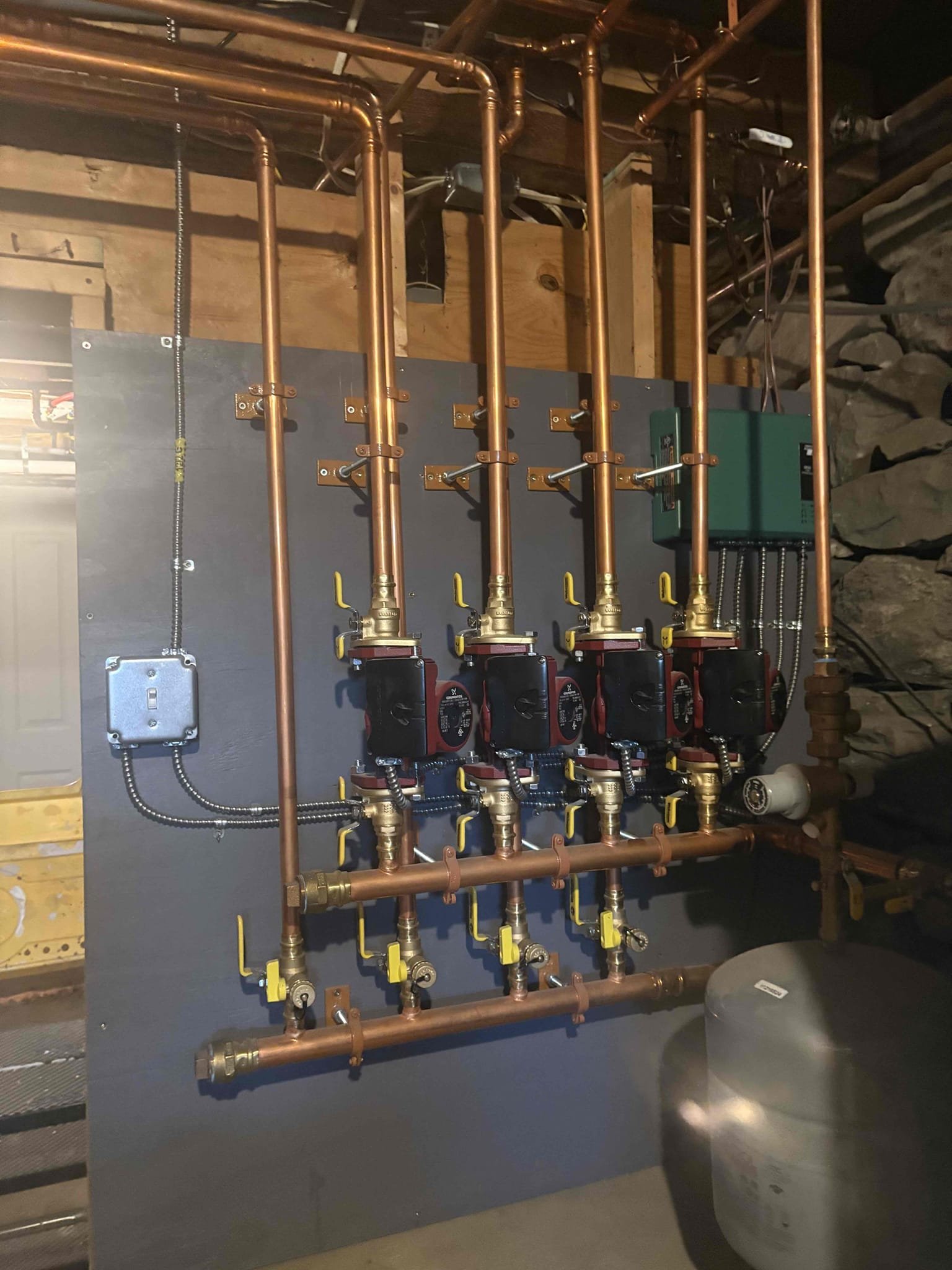 Responded to a report of no heat in the 1st floor bedroom. Dawn explained that this has been a continuous problem since installation, but now it is at its worst with no heat circulating. I confirmed proper operation of all components. I purged the zone and found air in the line that was compromising flow. After the zone was thoroughly purged of air I confirmed proper circulation. In addition to the air bound zone, I also identified that the new thermostat that was recently installed in the first floor bedroom was not operating properly and not successfully sending a call for heat. I also found a loose wire nut connection point that was contributing to the failed call for heat. I installed a new wire nut and reconnected the wire with confirmed contact. After confirming continuity from the board to the thermostat, I confirmed the new thermostat in the first floor bedroom had failed. 
Dawn and I discussed the individual zones and we concluded that her office space is connected to the base