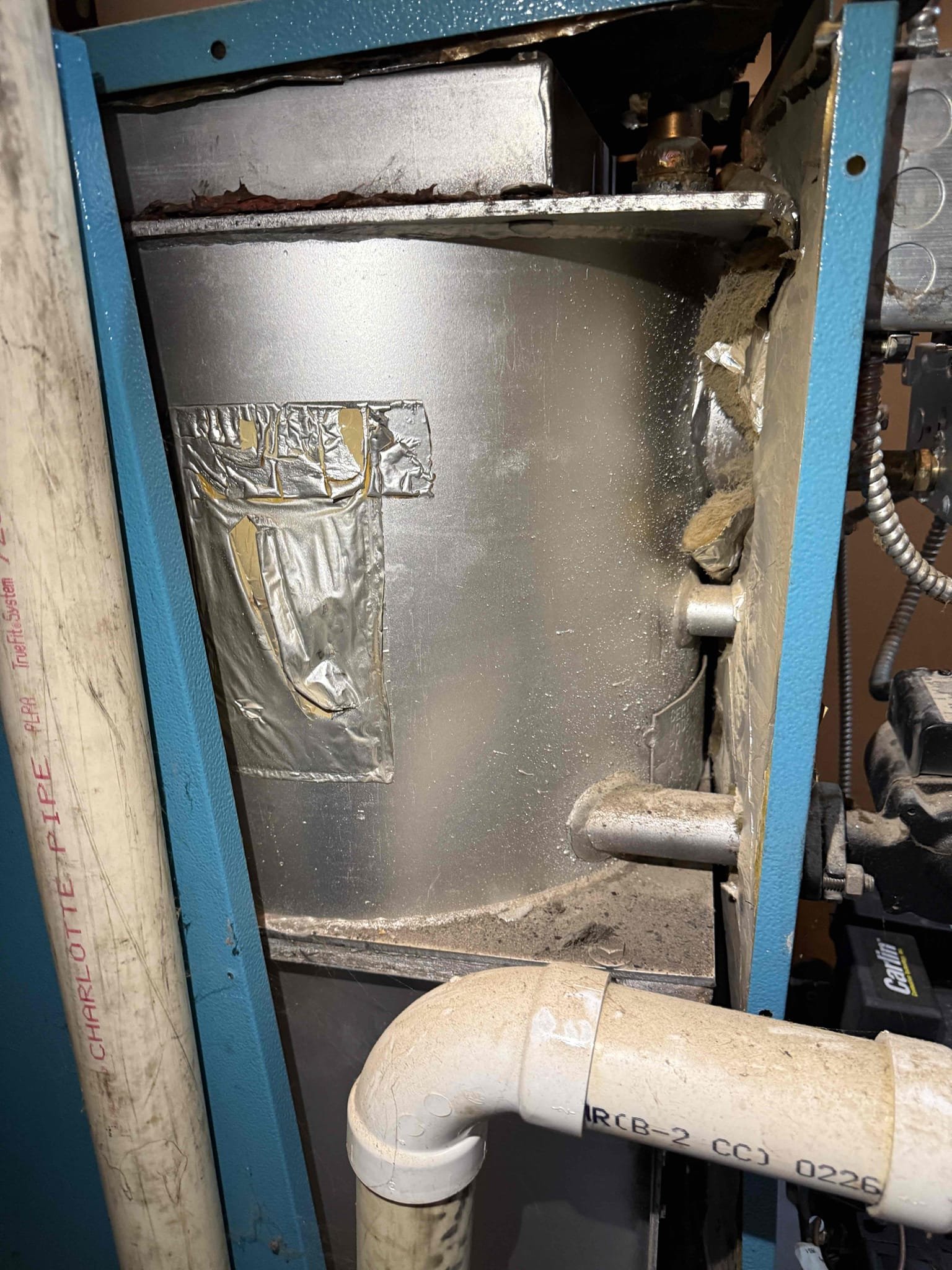 The customer reported no domestic hot water, though the heating system continued to operate. I manually opened the zone valve, and the water heater began heating properly. After testing, I confirmed that the zone valve head had failed.
This system utilizes a single circulator for both the heating and domestic hot water zones. The circulator is noisy and running hot. With the customer’s approval, I replaced the zone valve head and tested the system. I allowed the boiler to operate until the water heater reached temperature to ensure the new valve was closing and responding correctly to the call for heat. The system is operating properly at this time.

The water heater connections are heavily rusted, and we strongly recommend replacement before a leak develops. Additionally, the burner motor on the boiler is very noisy and should be replaced to prevent future failure.

I presented the customer with options for a new water heater, circulator replacement, and burner motor replacement. They