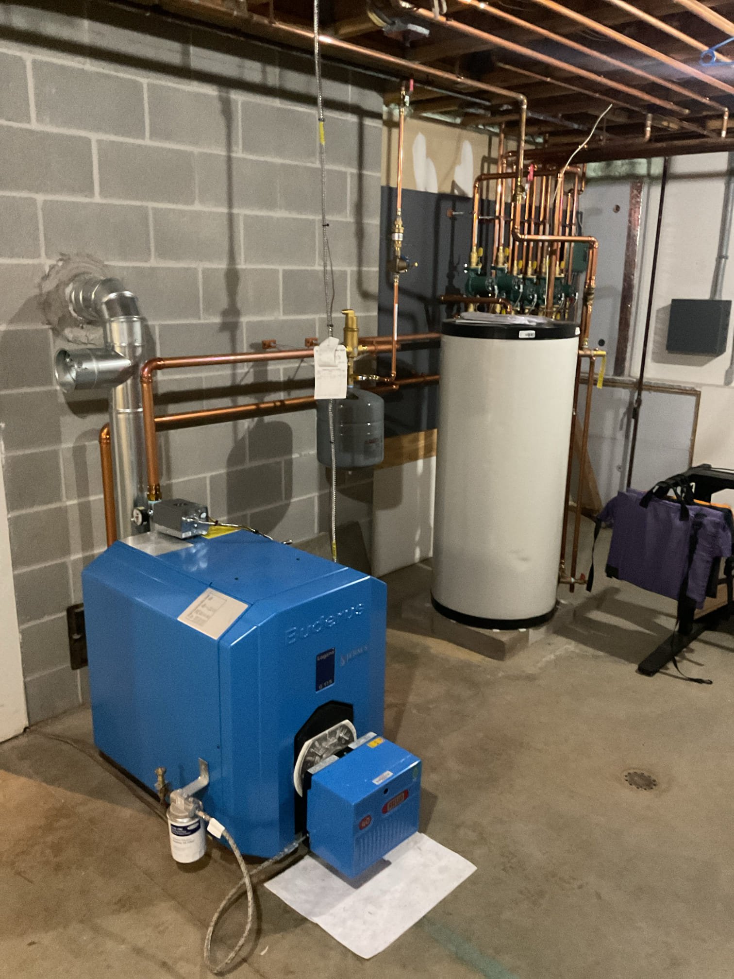 I performed an annual service on a Buderus oil fired boiler. I replaced the nozzle, filter, strainer, brush and vacuumed the heat exchanger and smoke pipe. I checked the system safety’s and performed a combustion test and draft test, everything is running as it should at this time.
The customer stated that at night they would hear a popping noise and believe it’s coming from their radiant zone below their bedroom. I ran the zone and was unable to hear the noise for myself. I found the relay when the zone would first come on would click a few times then come on the circulator for the radiant is getting very hot and should be replaced but everything else seems to be working as it should. The customer is going to take a video of it the next time the noise happens. I turned the radiant temperature from 150 to 130 as well.

There are a couple spots on the cold water line that got very rusted and corroded from hangers they would like a plumber to come out and take a look at replacing these s