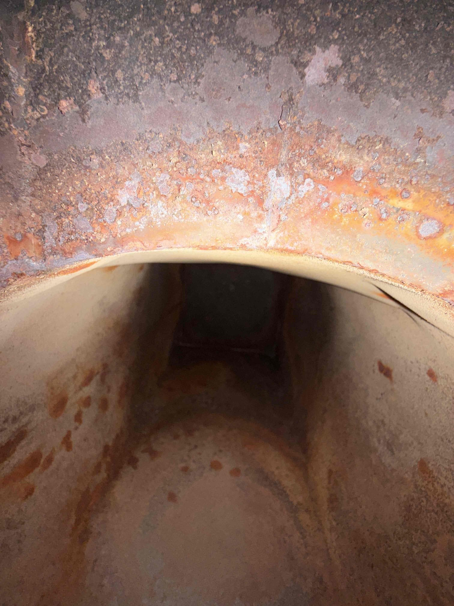 The customer reported that their furnace was producing a loud noise during operation, which would stop once the blower activated. I began by replacing the nozzle and verifying the electrode settings, which were correct. After re-firing the furnace, the noise persisted. I then removed the blower assembly and drilled two inspection holes in the supply plenum to perform a camera inspection. The heat exchanger was found to be heavily rusted; however, no visible cracks or holes were detected. I pulled the blower out of the back of the furnace and looked at the heat changer as much as I could visibly see and did not see any holes or cracks.
I tested multiple nozzle sizes and adjusted the pump pressure, but the noise did not improve. I ultimately returned to the original 0.75 x 80A nozzle and completed a full combustion analysis. I also performed multiple heat-exchanger tests, monitoring combustion values with and without the blower running. Combustion readings remained stable and did not shi