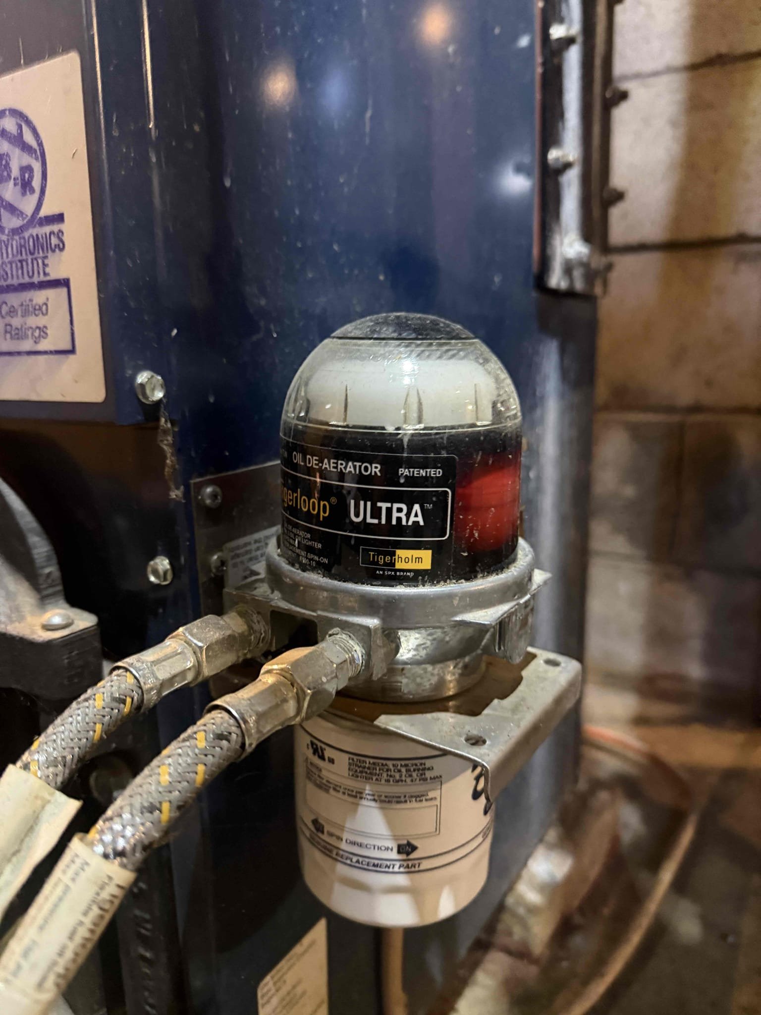 The customer reported that after installing an Ecobee thermostat in the living room, it was not communicating with the boiler. Upon inspection at the relay control, I confirmed that the thermostat was sending a signal to the relay; however, the relay had a broken wire, preventing the circulator from engaging. Each heating zone currently operates on its own older relay.

I recommended replacing the individual outdated relays with a single modern multi-zone relay panel capable of handling all four zones. The customer approved the installation of a new SR504 relay panel, as well as a Fast-Stat system to support the installation of an Ecobee thermostat for the upstairs zone. We will return to complete the installation.

The zone that is currently not operating is located in a room where the customer uses a wood stove, which is providing temporary heat.