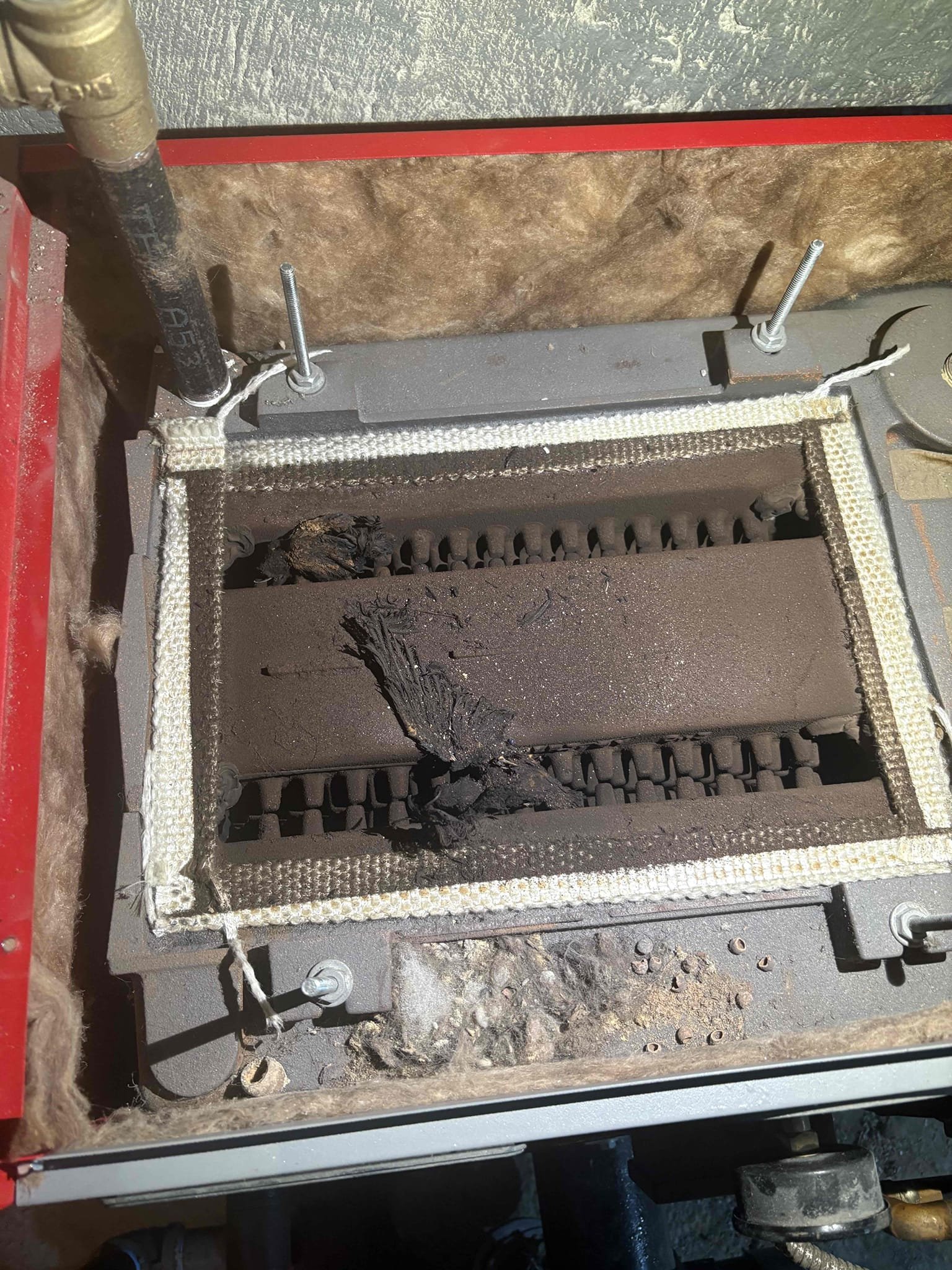 Arrived on scene for a report of the upstairs zone not working. Upon arrival, the upstairs zone was operating properly and circulating hot water. Amanda reported an additional concern about an intermittent chime or alarm-like sound that she believed might be coming from a safety device. I was unable to clearly hear the noise, and we could only briefly recreate it right after the boiler shut off. Based on the timing and tone, I believe the sound may be originating from the chimney, which was serviced in May 2025. I secured a loose pipe hanger and checked all hydronic components but could not identify the source of the sound. I also noted that the tridicator gauge is reading approximately 10 psi higher than the actual boiler pressure.

I performed annual maintenance on the Advantage oil boiler, including replacing the nozzle, oil filter, and pump strainer. I brushed and vacuumed the heat exchanger and flue pipe and found bird debris inside the heat exchanger, increasing my suspicion that