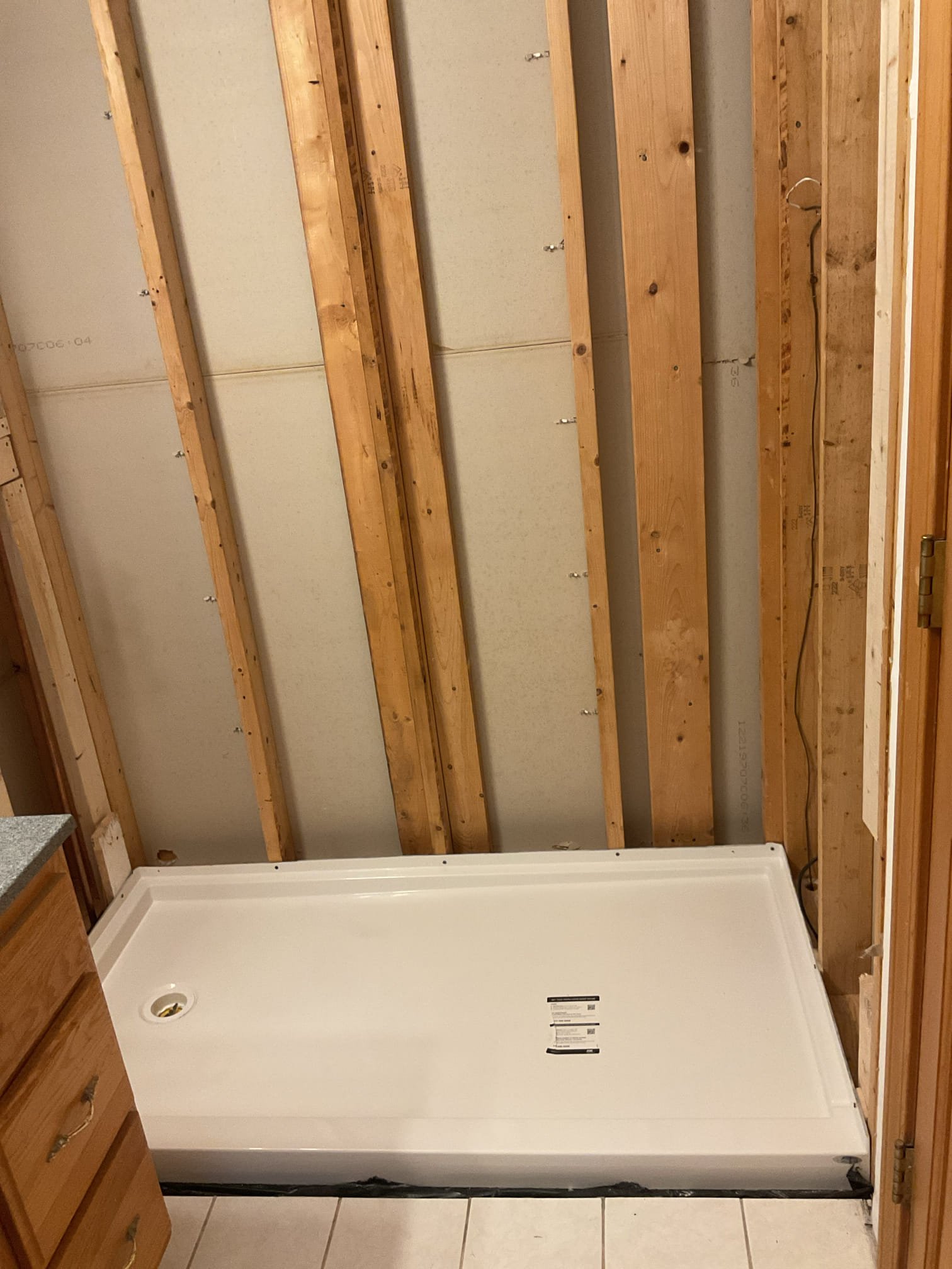 -Replace the tub/shower unit with an Aker Icon shower base
-Install Utile 6032, three piece shower wall kit in Origin Artik
-Install Maax Halo clear glass sliding doors


9/23/25
-Removed and disposed of the drywall around the existing tub/shower unit
-Cut, removed and disposed of existing fiberglass tub/shower unit
-Installed a new Delta shower valve
-Installed mortar on the subfloor with a plastic vapor barrier
-Installed the shower pan
-Installed the 2” shower drain and ptrap
-Will return to install the shower walls and install the shower valve trim

9/25 
Attempted to install the fiberglass walls but one sidewall and the back wall were severely warped prevented a proper installation. Contacted the warranty number from the packaging and two new walls are going to be delivered to the customers home. Warranty number is #301907185. 
-Will return when the walls have been delivered

11/12/25
Installed fiberglass shower walls and the drop ear 90°to accommodate for the shower arm. Applied 