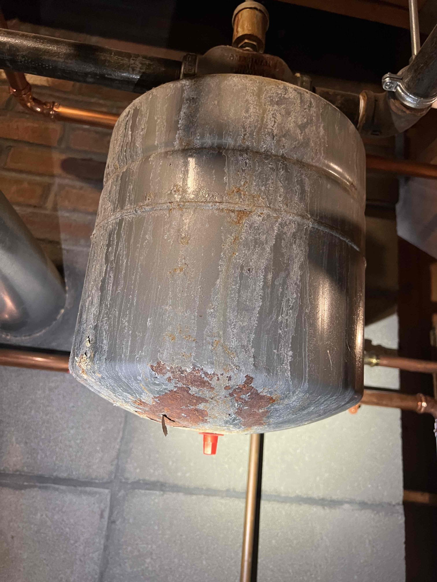 Arrived onsite to diagnose a no-heat issue on a propane boiler. We had performed an annual tune-up on Friday, 12/6/25, during which we provided an estimate to replace a worn thermocouple that the customer declined. They replaced the thermocouple themselves and experienced intermittent issues until the system eventually stopped producing heat. They also reported a gas odor when they contacted me on Sunday, 12/7/25, and I advised them to shut off the gas immediately.

Upon arrival, I bubble-tested the pilot line and confirmed it was leaking. I advised the customer that all gas-related work should be performed by a qualified gas professional due to the associated safety risks. I replaced the pilot line and found that the thermocouple holder was melted, causing the thermocouple to be stuck in place. After reassembly, the pilot would not remain lit. Due to the damaged thermocouple holder, I recommend replacing the entire pilot assembly and thermocouple.

Additionally, the expansion tank is 