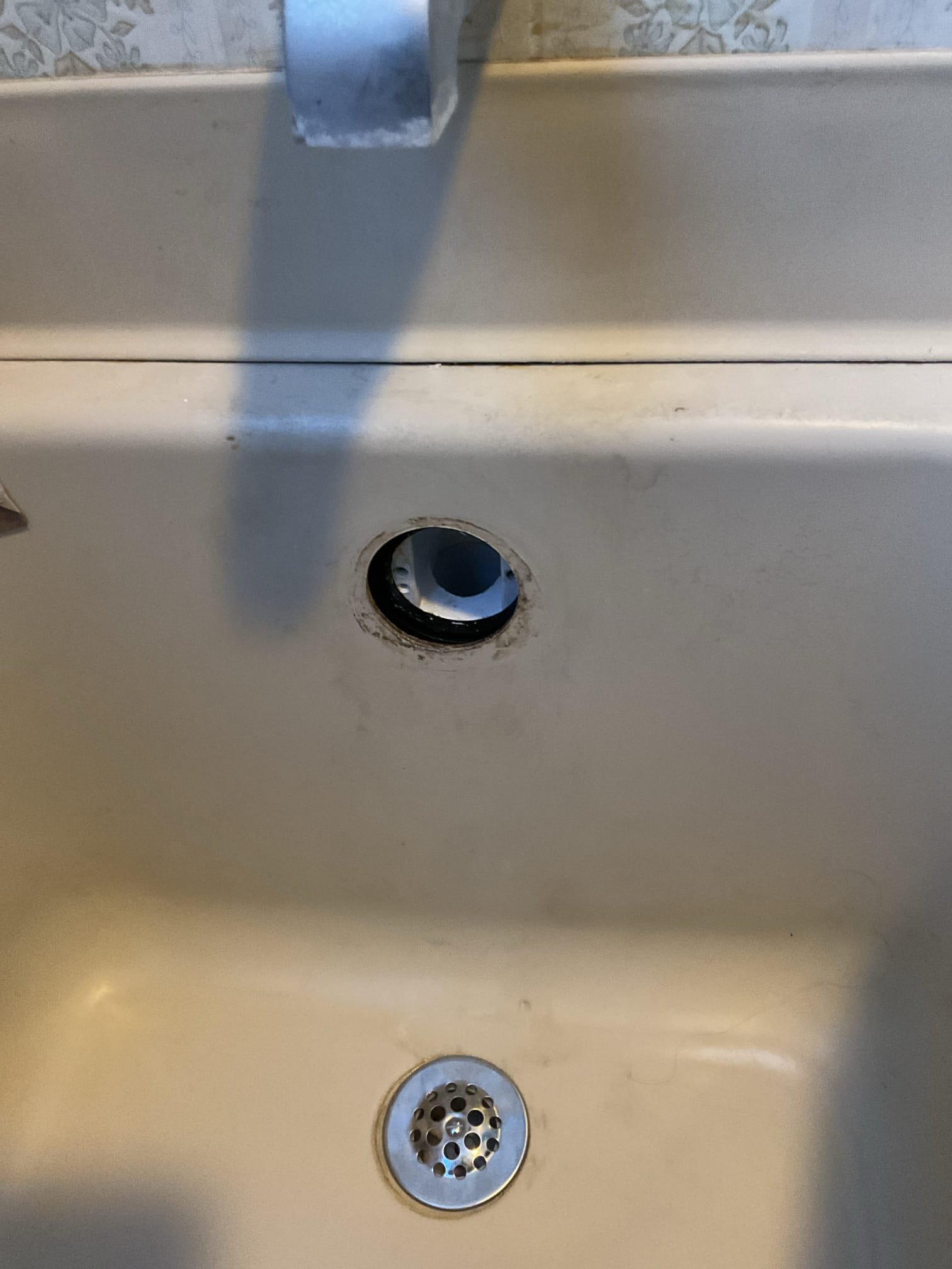 For this job, we returned to inspect the previously replaced tub waste and overflow assembly. We found that the trip lever had become disconnected, so we reconnected it and tested the assembly to ensure proper operation. The mechanism held as it should and was not leaking by. We also applied silicone to the cover plate for a secure and finished installation. The system was left operating correctly.