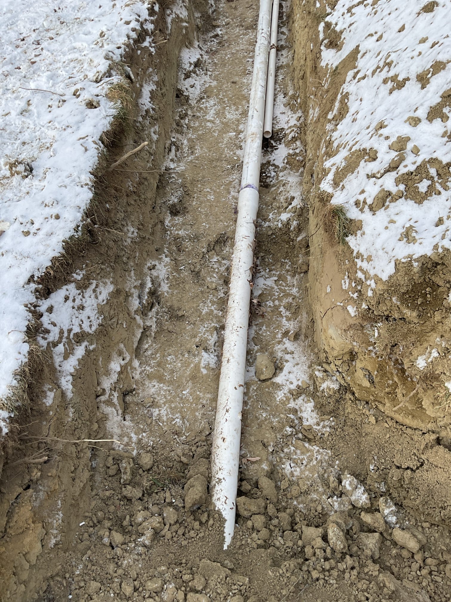 This was a follow up visit to test the drainage connections within the home since the new septic was completed. The water for the second floor bathroom was turned on and the fixtures were tested.
-Tested the kitchen sink faucet to properly test the newly installed cartridge and drainage connections
-Tested the first floor lavatory drainage. Noticed a leak on the popup assembly. Tightened the plastic nut to secure the rubber gasket to the bottom of the lavatory. Tested, no leaks. There was no work performed on the popup assembly during this project
-Tested the laundry drainage and the water softener drywell drain receptacle by using a washer hose to introduce water to the drains with.
-All drainage was tested and no leaks were present.
-The exterior drywell drain was not connected by the septic contractors during this visit, so I was unable to place the water softener into service. 