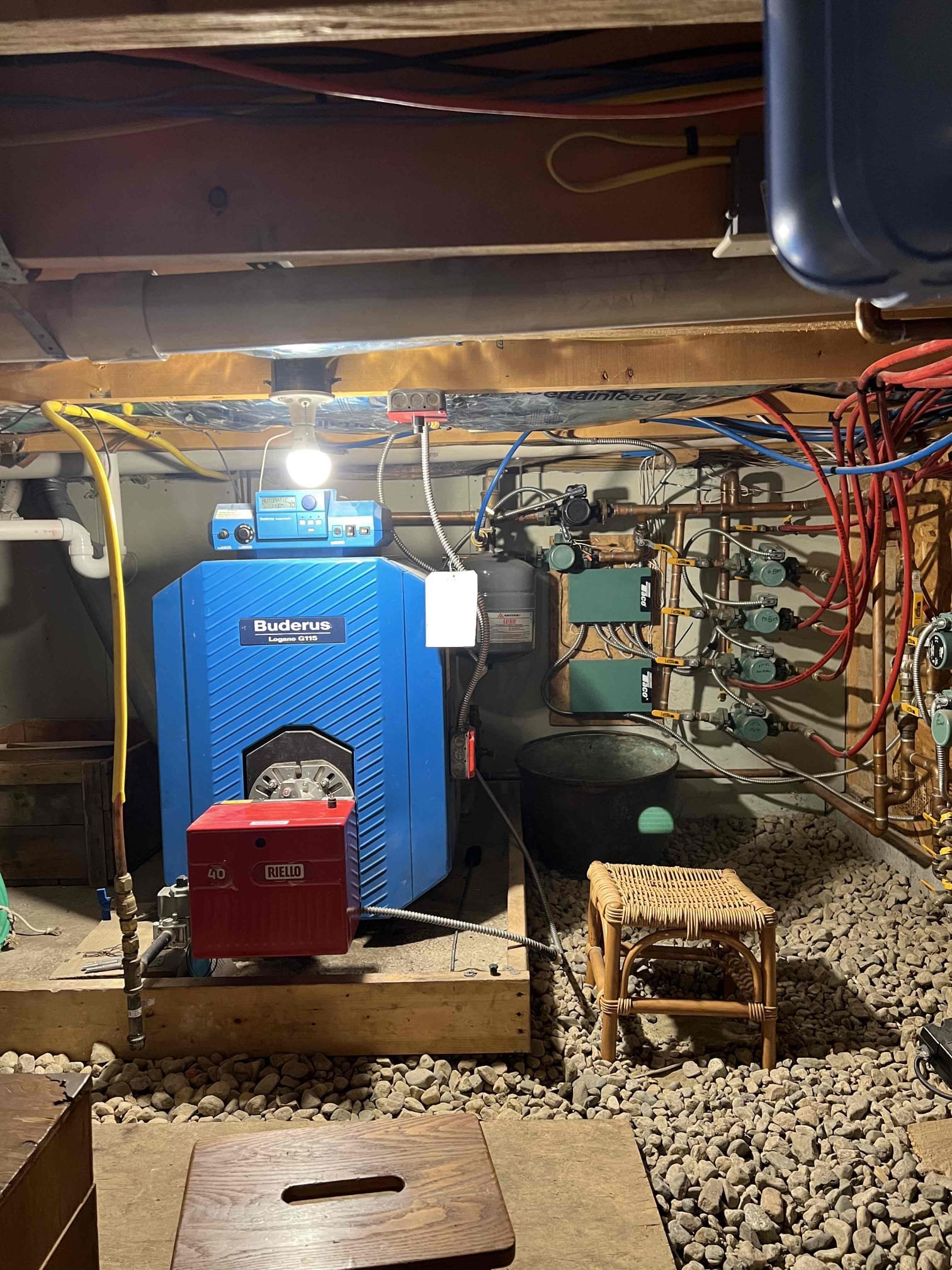 Arrived onsite to investigate insufficient heat in the master bathroom and bedroom. The bathroom has radiant heat and the bedroom has baseboard. The bathroom thermostat was reading 69°F, but the space felt colder. We verified that both zones were heating by turning the thermostats up. The bathroom radiant loop was at 140°F and the bedroom baseboard was hot. I opened the louvers in the bedroom. I replaced the bathroom thermostat as a first step in diagnosing the insufficient heat and verified proper operation. The system is functioning correctly at this time. I emailed estimates for recommended boiler work.