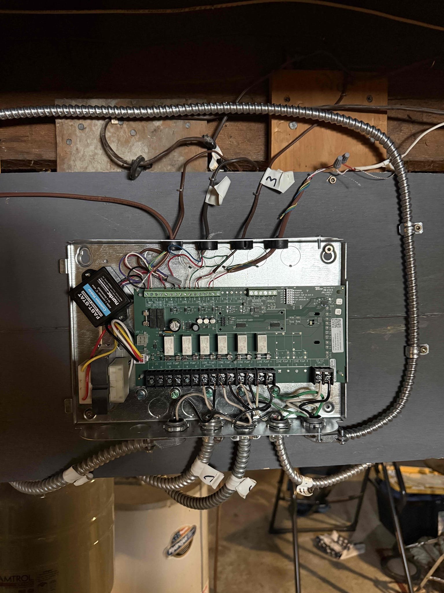 Removed four existing SR501 relay controls and installed a single SR504 relay control to properly manage all circulator pumps and thermostat connections. All circulators and thermostat wiring were landed and verified at the new control. Installed a Fast-Stat system on the upstairs zone to accommodate limited existing wiring and installed a customer-supplied Ecobee thermostat.

Ran new control wiring from the SR504 to the boiler aquastat, replacing the previous jumper configuration. This now allows the boiler to operate only on a verified call for heat rather than continuously running off the high limit.

Tested operation of each thermostat and corresponding zone to confirm proper circulator engagement, boiler operation, and system shutdown. All zones were labeled accordingly. System is operating properly at this time.