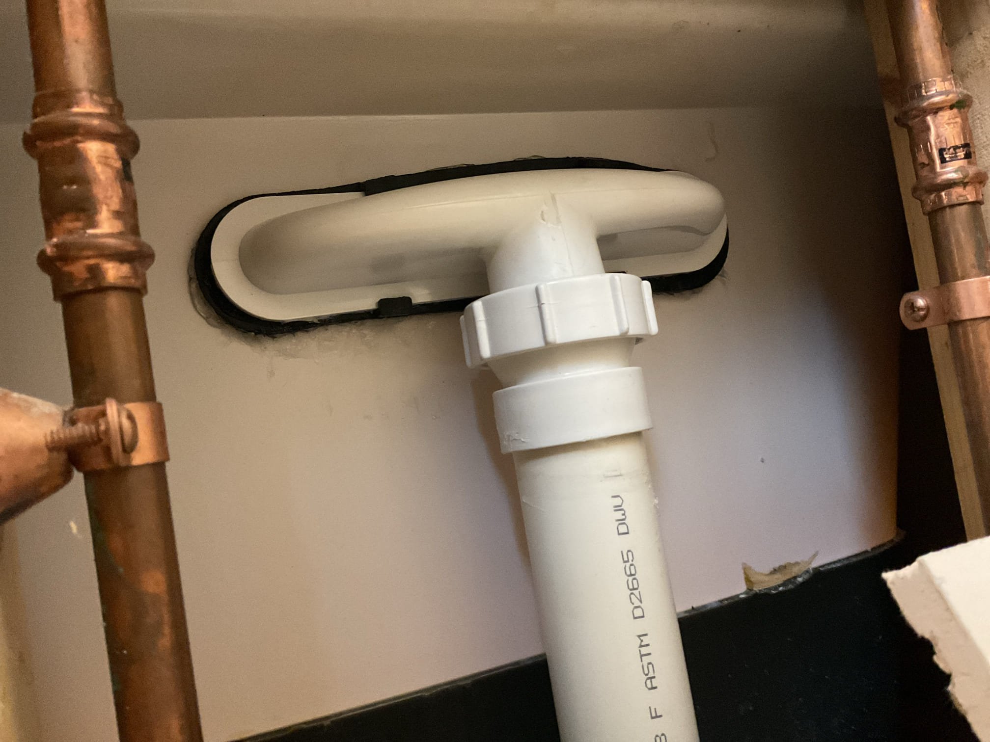 Cut access behind tub shower and replace the Kohler waste and overflow head, gasket, and bracket. After assembled we waited 30 minutes for silicone to become tacky and sprayed all of the tub shower walls and fixtures for 15 minutes with hand pump sprayer. No leaks are detected at this time.