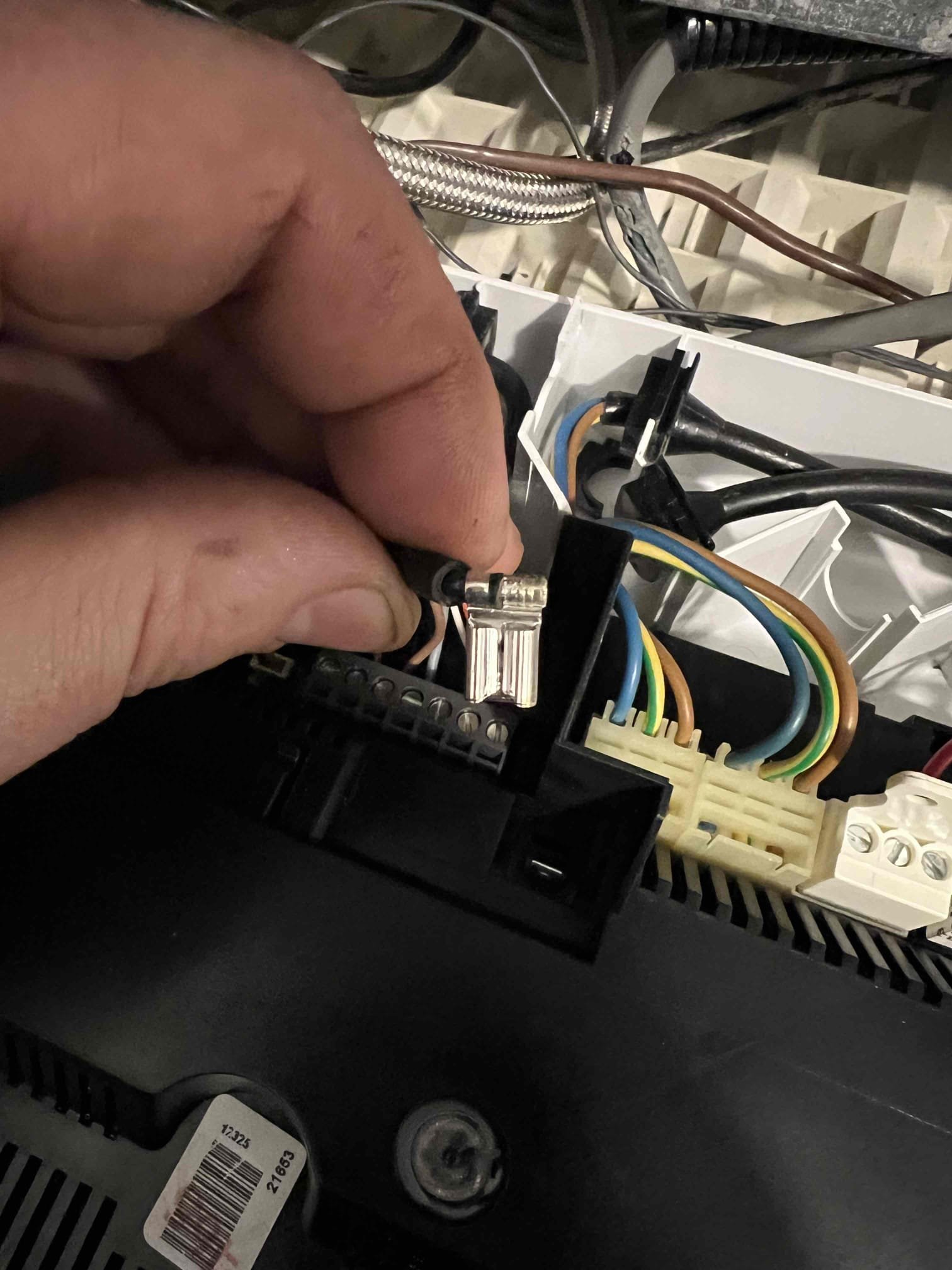 Arrived on site to investigate a no-heat issue on a Viessmann propane boiler. The boiler was displaying error code E8, indicating that the ionization current was outside the permissible range. According to the manufacturer’s manual, this error points to the ionization electrode.

I performed an annual tune-up last month and replaced the inducer fan last Friday. During the tune-up, the ionization electrode was cleaned and appeared to be in good condition. While troubleshooting, I inspected the wiring and found the connection to the ionization electrode was loose. I tightened the connection and reset the boiler three times. The system is operating properly at this time.

If this issue reoccurs, I recommend replacing the ionization electrode and wire.

Due to the fact that I disconnected the ionization electrode twice in the last month, this visit is covered under Jerm’s warranty.