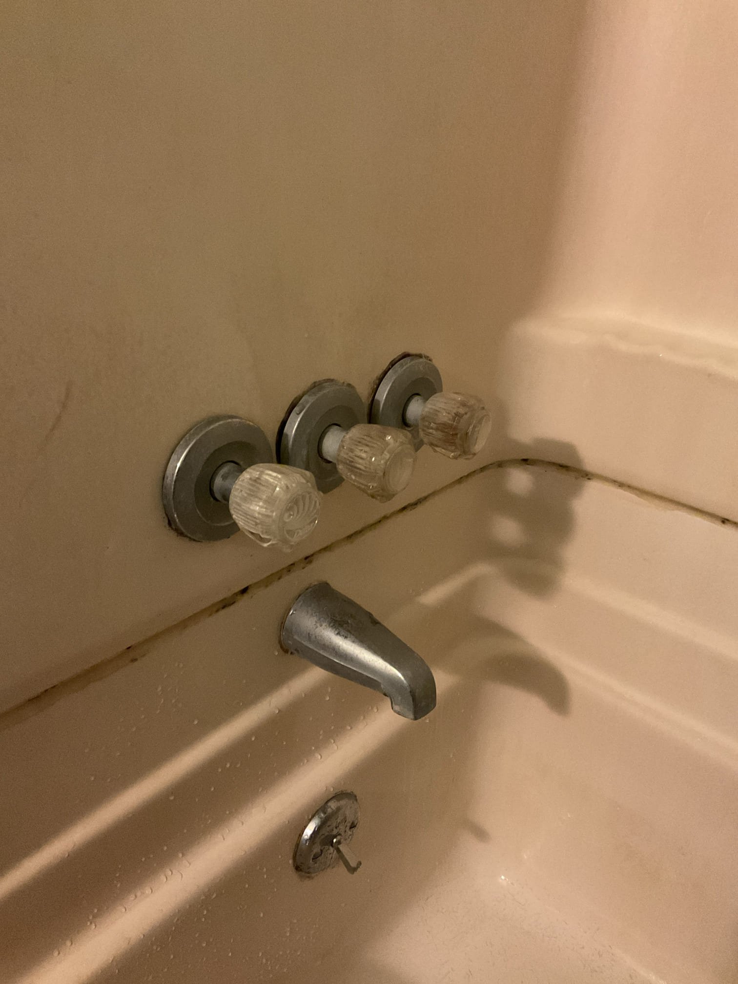 Homeowner had water leak coming from the ceiling beneath her bathroom. After our thorough evaluation we discovered there was nickel sized hole in the “shoe” of her bathtubs waste and overflow and her shower valve has a slow drip due to failed cartridges. We replaced the waste and overflow to restore proper leak free drainage. We ordered a new finish kit with cartridges for her shower to stop the dripping spout and improve appearance of the shower 

12/19/25
Service was performed to complete repairs from a previous visit by installing new three-handle shower trim and internal components that had been ordered. Upon arrival, the existing shower handles, hardware, and cartridges were removed. New handles, hardware, and cartridges were installed and properly secured.

After installation, the shower was tested for proper operation and inspected for leaks. All components operated as intended, and no leaks were observed at the time of service. The system was left in proper working order upon c