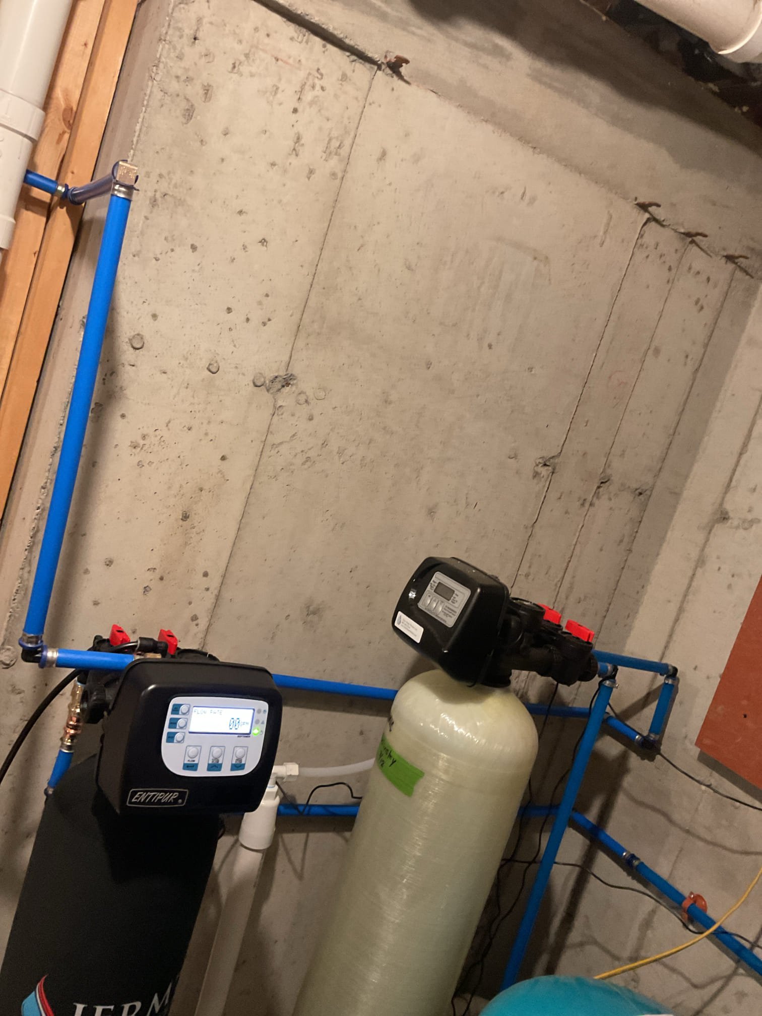 A one-cubic-foot water softener was installed at this location and tied in after the existing filtration system. All necessary plumbing connections were completed, and the system was thoroughly tested to confirm proper operation with no leaks present. A new drain connection was cut into the 3-inch main drain stack to properly accommodate the softener discharge. The regeneration cycle was programmed to run every 14 days at 2:00 AM. Upon completion, the system was placed into service and tested, and it was confirmed to be operating correctly. It is recommended that this unit receive annual maintenance to ensure continued high-level performance, and we also recommend returning in a couple of weeks to verify that the softening system is effectively removing all grains of hardness.