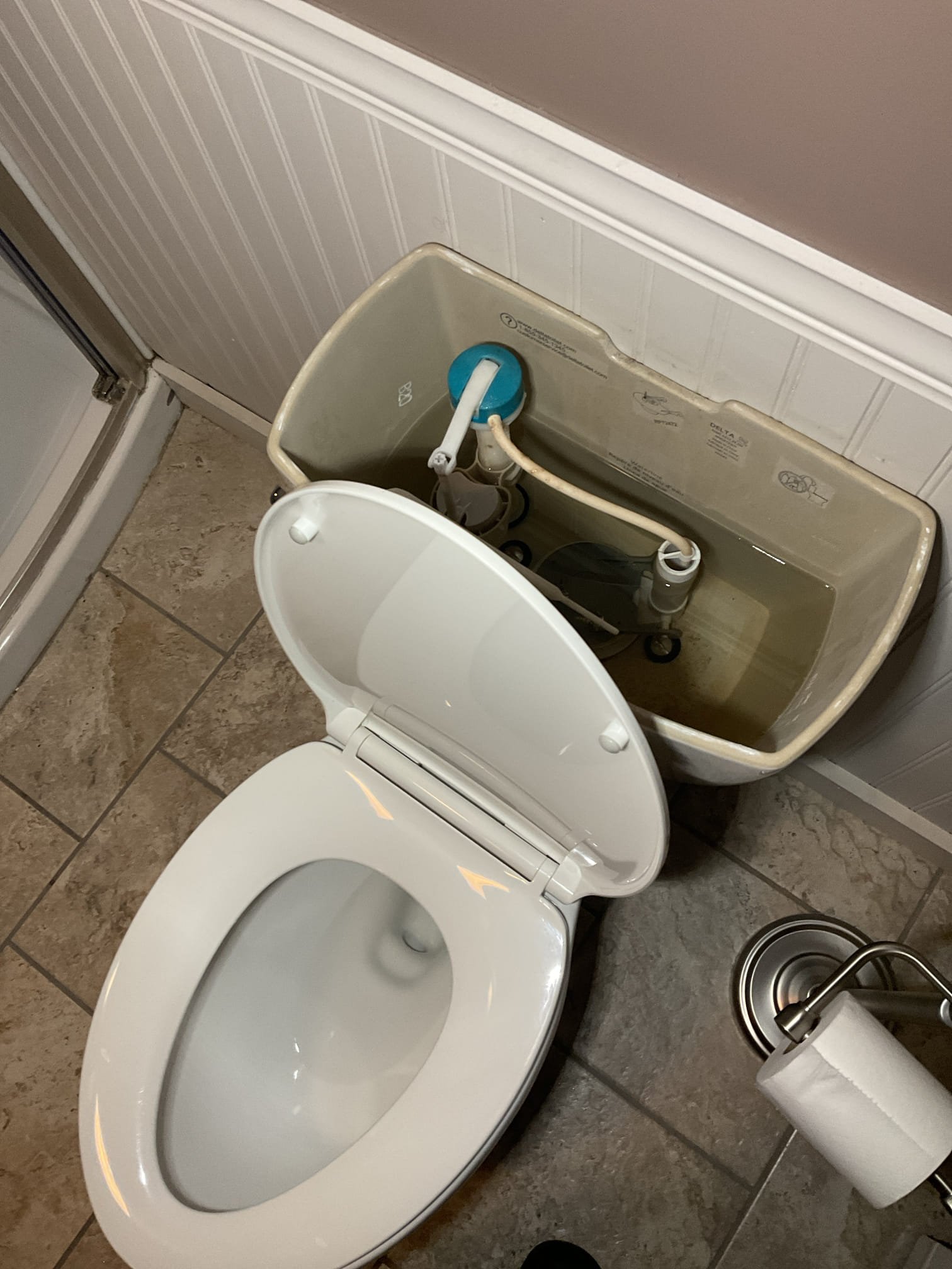 For this service call, the homeowner expressed concerns about a possible shower leak and low water level in the toilet bowl. Upon inspection, the toilet bowl fill level was found to be normal and functioning properly, with any excess water draining correctly through the trap. The shower was tested and inspected from the basement with no leaks observed; the brief dripping after use was determined to be residual water draining from the showerhead. Additionally, the main water shutoff valve was located and its location explained to the homeowner.