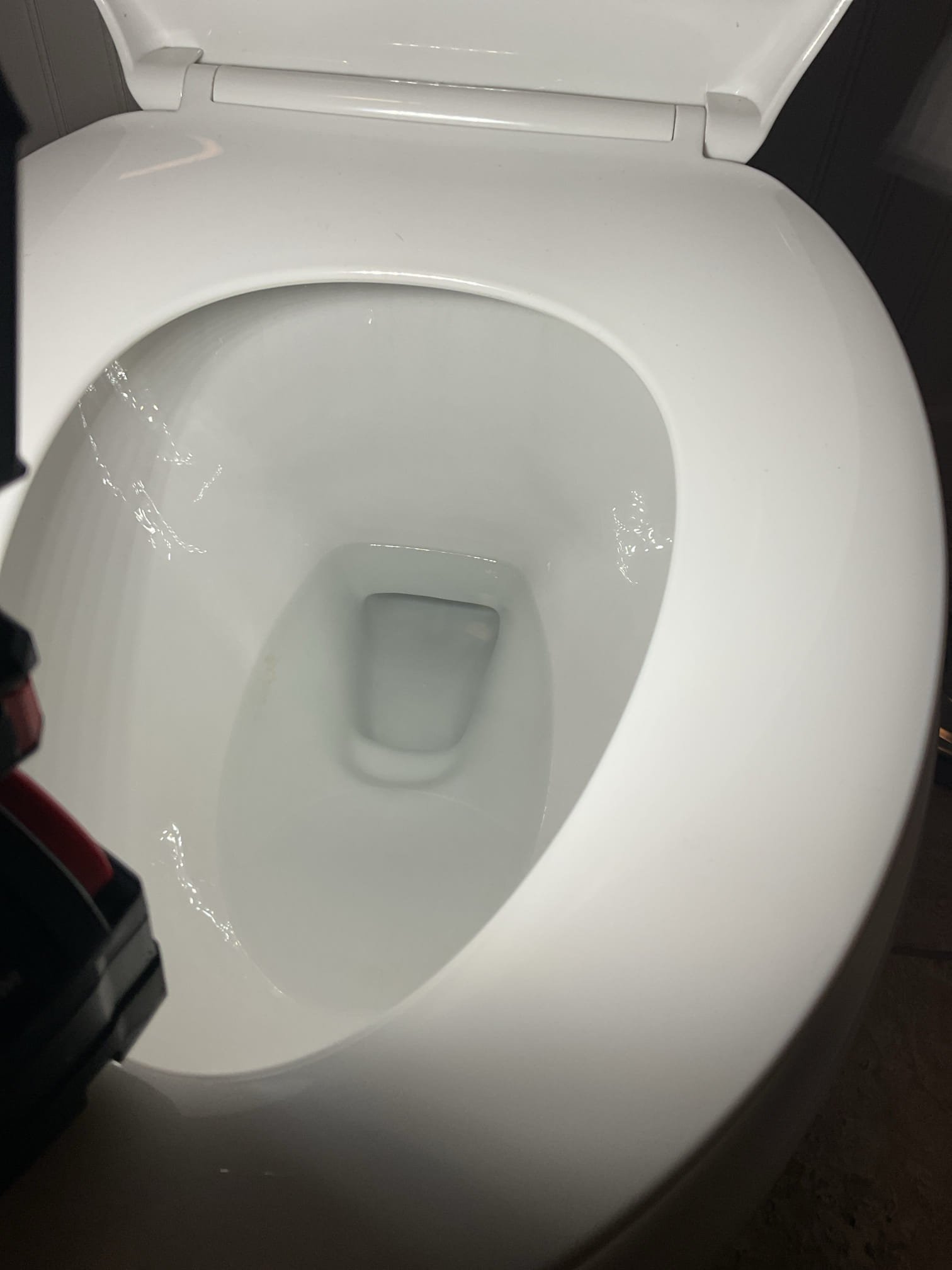 For this service call, the homeowner expressed concerns about a possible shower leak and low water level in the toilet bowl. Upon inspection, the toilet bowl fill level was found to be normal and functioning properly, with any excess water draining correctly through the trap. The shower was tested and inspected from the basement with no leaks observed; the brief dripping after use was determined to be residual water draining from the showerhead. Additionally, the main water shutoff valve was located and its location explained to the homeowner.