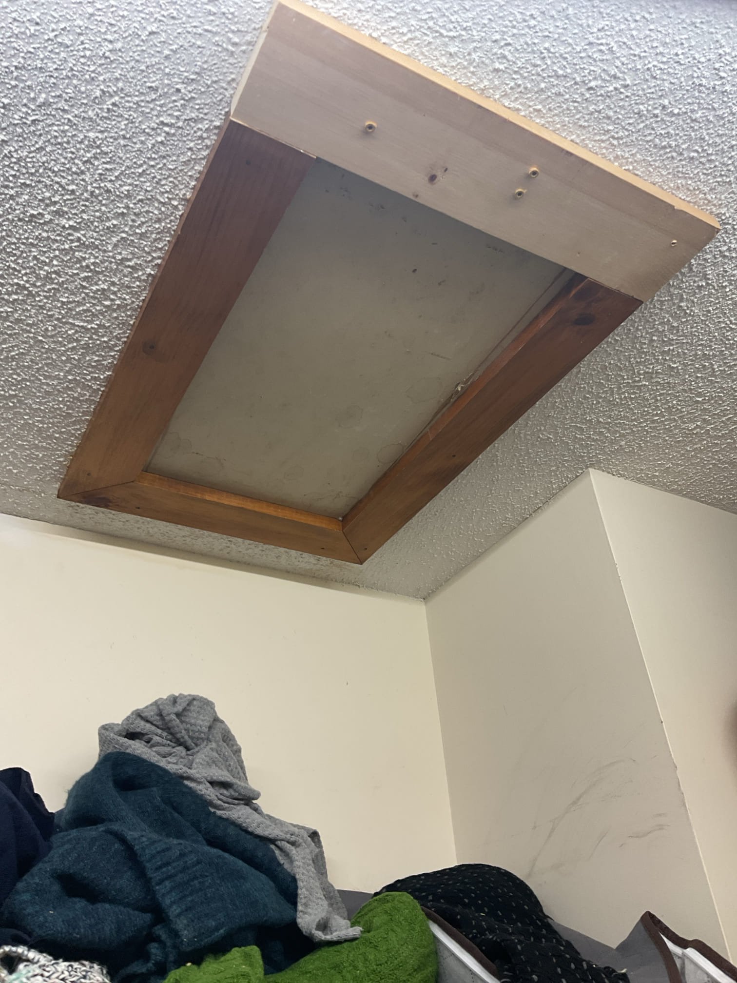 For this service call, the homeowner reported a suspected leak originating from the attic. Upon arrival, two areas of water damage were confirmed in the ceiling of the primary bathroom. Inspection of the attic revealed leaks at two bathroom exhaust fan discharge lines; this condition had occurred previously and was only temporarily resolved at that time. The half-bath exhaust connection showed ice buildup at the transition from the plastic discharge line to galvanized piping, and the primary bathroom fan was leaking at the plastic connection to the unit, with sagging piping that allowed condensation to collect.

After discussing findings with the homeowner, it was determined that the likely cause is reduced fan performance combined with uninsulated exhaust piping, allowing moisture to cool and condense before exiting the home. An estimate will be provided to replace both exhaust fans and to replace sections of the discharge lines with new, insulated metal piping to help prevent future 