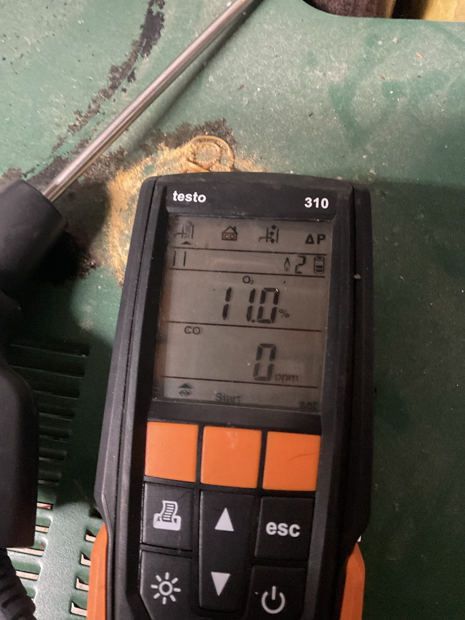 Arrived on site to diagnose no heat on propane boiler. After our initial inspection, we found that the spark igniter had some soot buildup on it.mwe cleaned it off and boiler started right up. When boiler started there was a very loud subwoofer like sound. We provided an estimate to do a tune up so we could dig deeper into the cause of the noise. It was accepted. 

We started by turning the gas off and pulling the burner tubes out. We found that they were dirty and had a lot of debris built up inside of them and the burner compartment. We wired brushed the burners and vacuumed out the compartment. We then inspected the heat exchanger which looked good. We put the burners back into place and connected pilot tube. Checked for gas leaks using bubbles. Hooked up manometer and checked gas pressure when boiler kicked on. Pressure was good and the subwoofer-like sound went away after we cleaned the burners. Performed a combustion analysis and checked for CO leaks. Analysis was good and no CO 