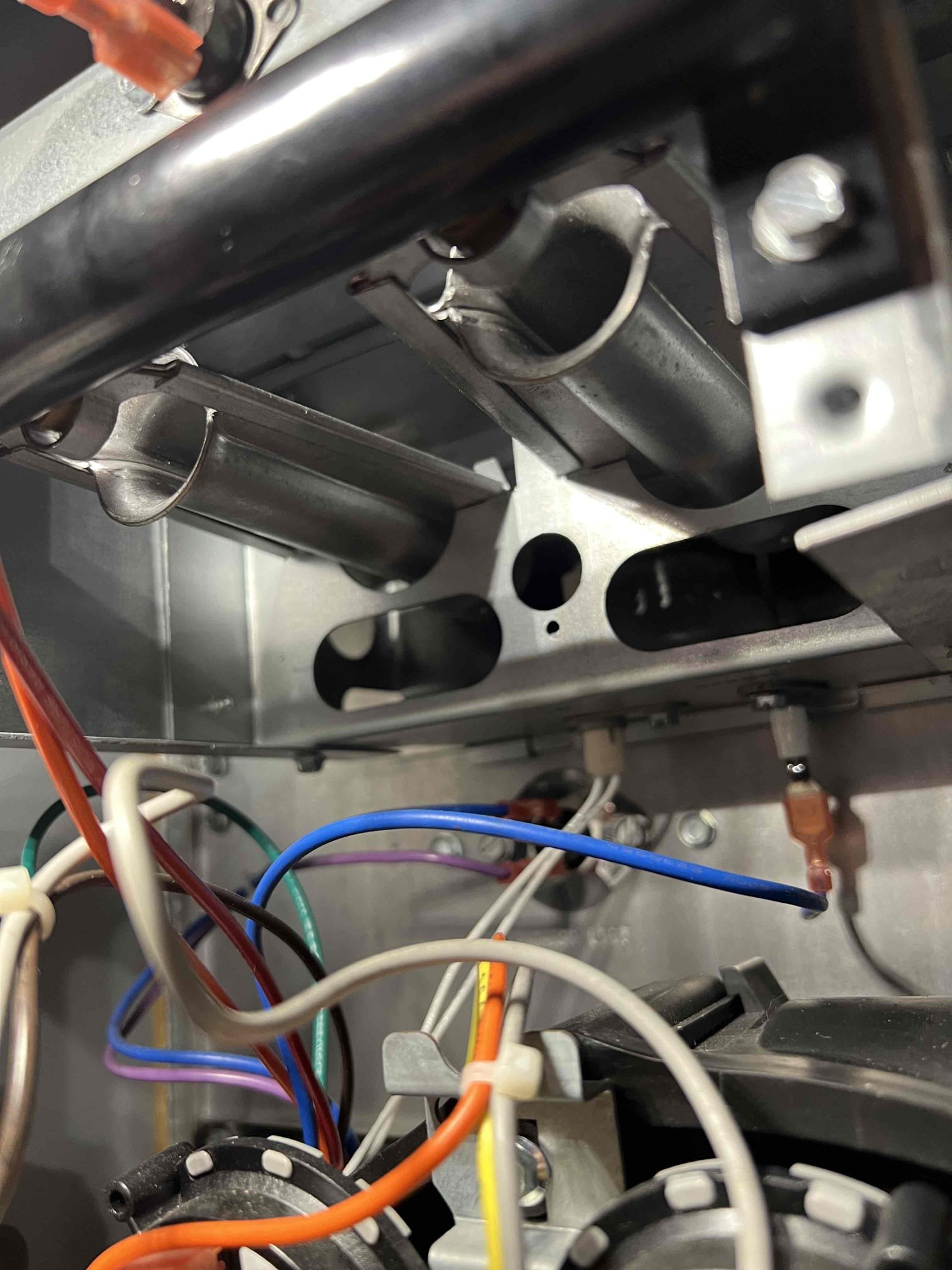 Replaced rusted burners on a Goodman propane furnace. Performed a bubble test on the gas line; no leaks were found. Checked carbon monoxide levels and confirmed there were no leaks present. Verified proper operation—system is working correctly at this time.