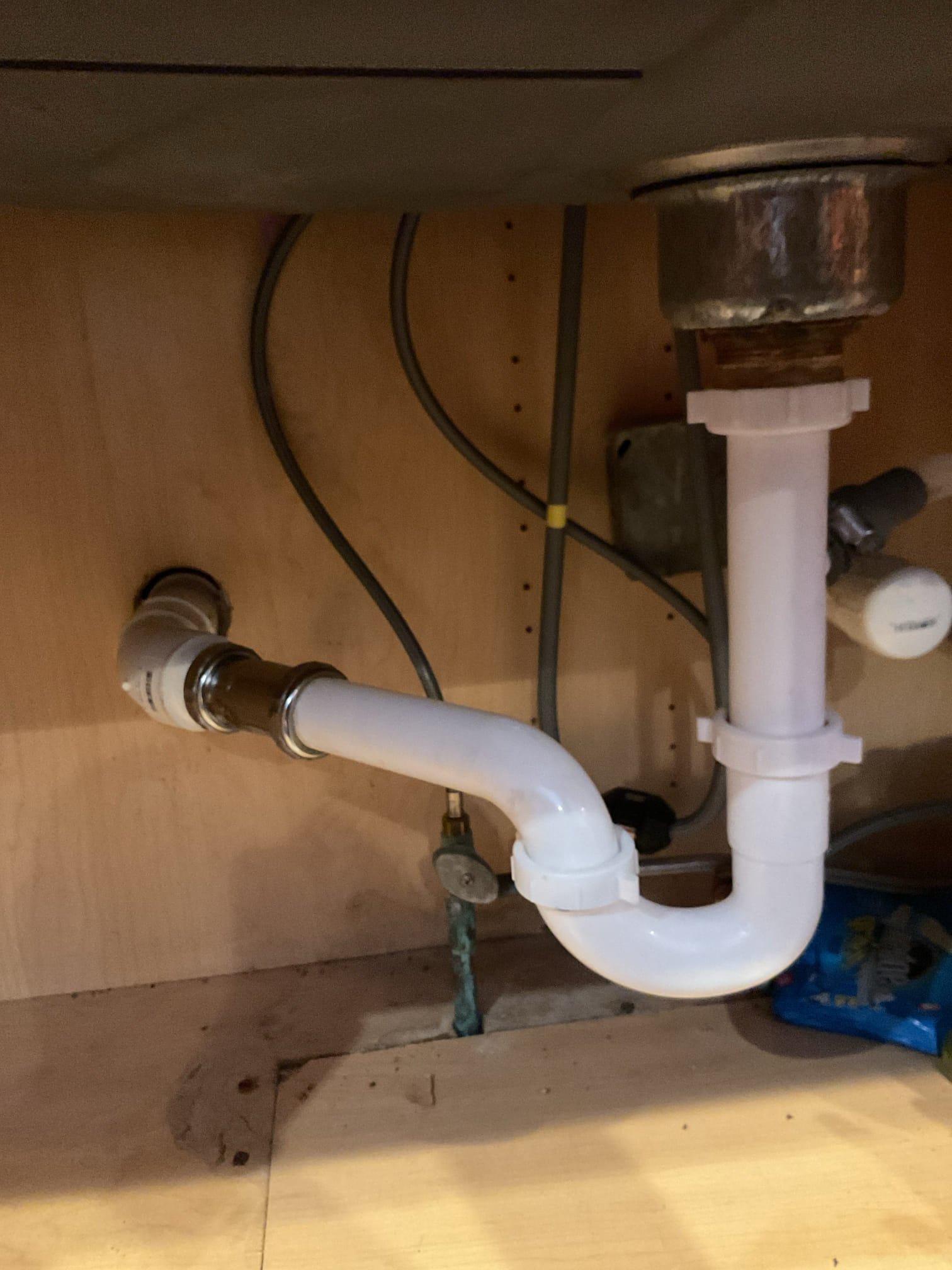 Upon arrival the kitchen trap was leaking and the wet tailpiece was very corroded. I removed both and found the drain to be clogged. The threaded 45 by the wall was back pitched causing it to build up with food and grease. I snaked the drain and ran water down the drain and repeated the process until I was happy with the drainage. 

I then put the wye and trap back on and attached the dishwasher discharge hose back on. Everything is working well with no leaks at the time of service. 

I also built an estimate to replace a leaking cartridge for the soaker tub. 

