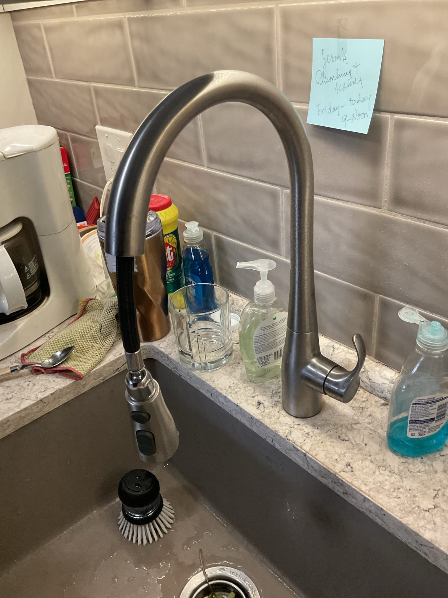 The spray head on the Kohler faucet was replaced after diagnosing a noticeable loss of water pressure when the spray head was installed compared to when it was removed. Upon inspection, the existing spray head was found to be internally restricted and no longer functioning properly, which was limiting water flow. The old spray head was removed and a new, compatible Kohler spray head was installed and securely connected. The faucet was then tested in both standard flow and spray modes to confirm proper operation and restored water pressure. At completion, the faucet was operating as designed with consistent pressure and no leaks observed. Customer would like a hard copy of receipt sent to her as well as email.