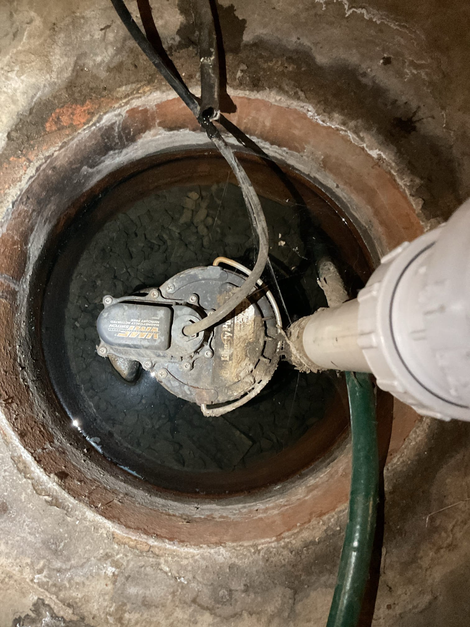For this job, we came out to evaluate a sump pump that was reported to be running continuously. Upon inspection, we cycled the sump pump approximately 8–10 times and confirmed that it was operating and cycling as it should at the time of service. Although both sump pumps were found to be currently functional, we will be providing estimates for replacement of both units as a peace-of-mind option for the customer due to their age and prior concerns. During our visit, we also noted a Thermal Pride propane furnace with a puddle of water present beneath it. We advised that a qualified HVAC technician should evaluate the furnace if the customer is interested, as it is outside the scope of plumbing service.