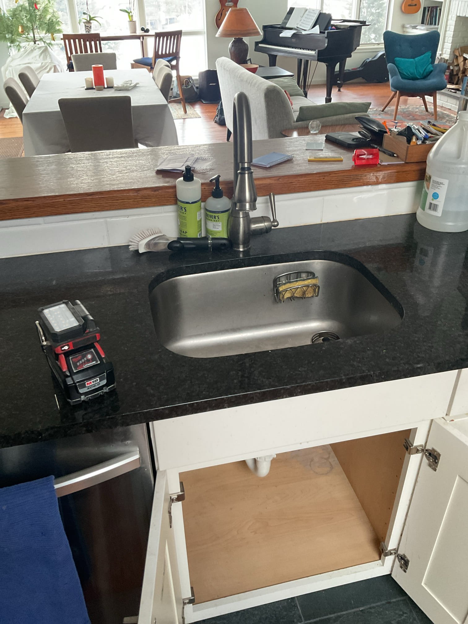 The kitchen drain line was partially blocked, resulting in slow and restricted drainage. We attempted to clear the line using an electric snake, accessing the system through the p-trap and running the snake approximately 15 feet with multiple passes to remove food and grease buildup that was causing partial blockage. The large majority of grease was obstructed about 6’ into line just after 90 fitting, this was extremely thick obstruction. The p-trap was reinstalled, and the line was flushed with warm water. A drain cleaner (Thrift) was added to help break down any remaining buildup. The sink was tested multiple times by filling and draining the basin, confirming proper operation with no leaks present at this time.