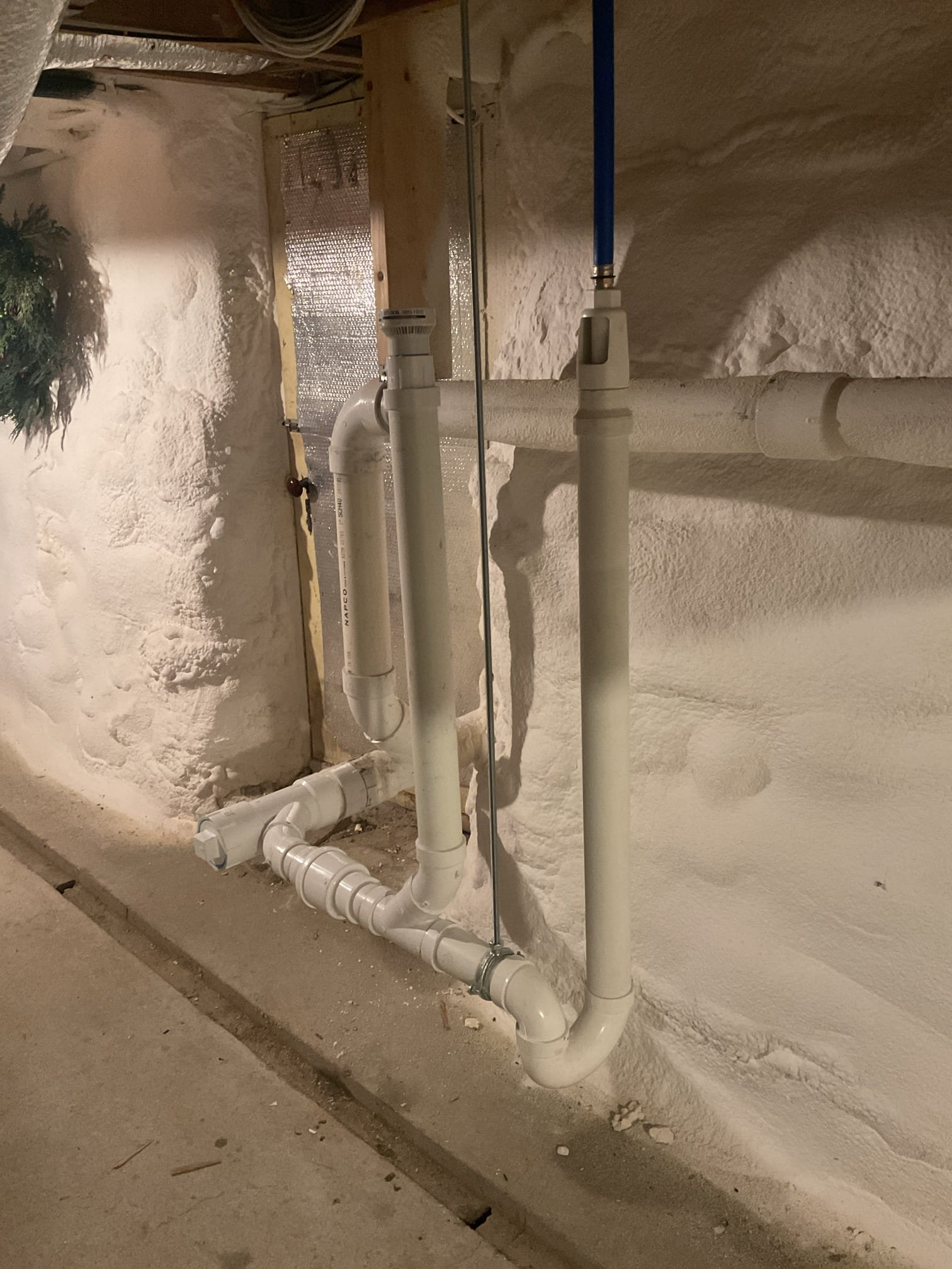 
Upon inspection, the water softener drain was found to be piped incorrectly, causing the trap to siphon and allowing sewer odors and methane gas to enter the home. The improperly installed drain was cut out and removed, and a new drain was installed correctly, including a check valve and proper venting. The system was tested to confirm proper drainage and trap seal, restoring safe and odor-free operation.