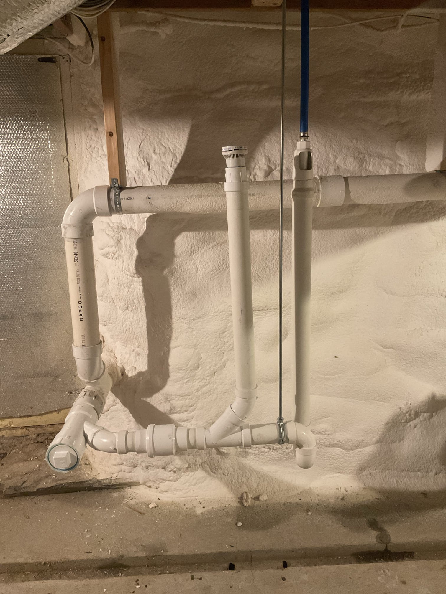 
Upon inspection, the water softener drain was found to be piped incorrectly, causing the trap to siphon and allowing sewer odors and methane gas to enter the home. The improperly installed drain was cut out and removed, and a new drain was installed correctly, including a check valve and proper venting. The system was tested to confirm proper drainage and trap seal, restoring safe and odor-free operation.