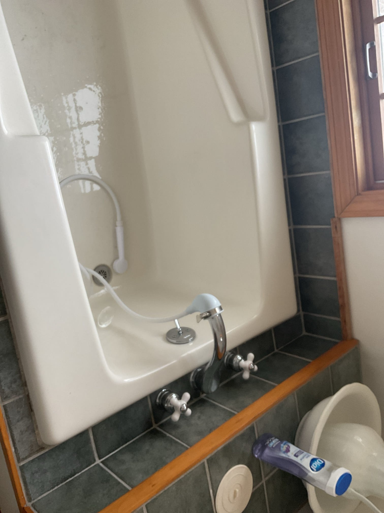 For this visit, the homeowner reported that the hot handle on the Roman tub faucet was not operating properly. Upon inspection, we found the plastic handle adapter was broken and the brass handle insert was freely spinning, preventing proper engagement of the cartridge; the appropriate replacement parts were identified, and estimates for replacing the handles, adapters, and cartridges were provided and emailed to the customer for approval, as the parts are not currently available.