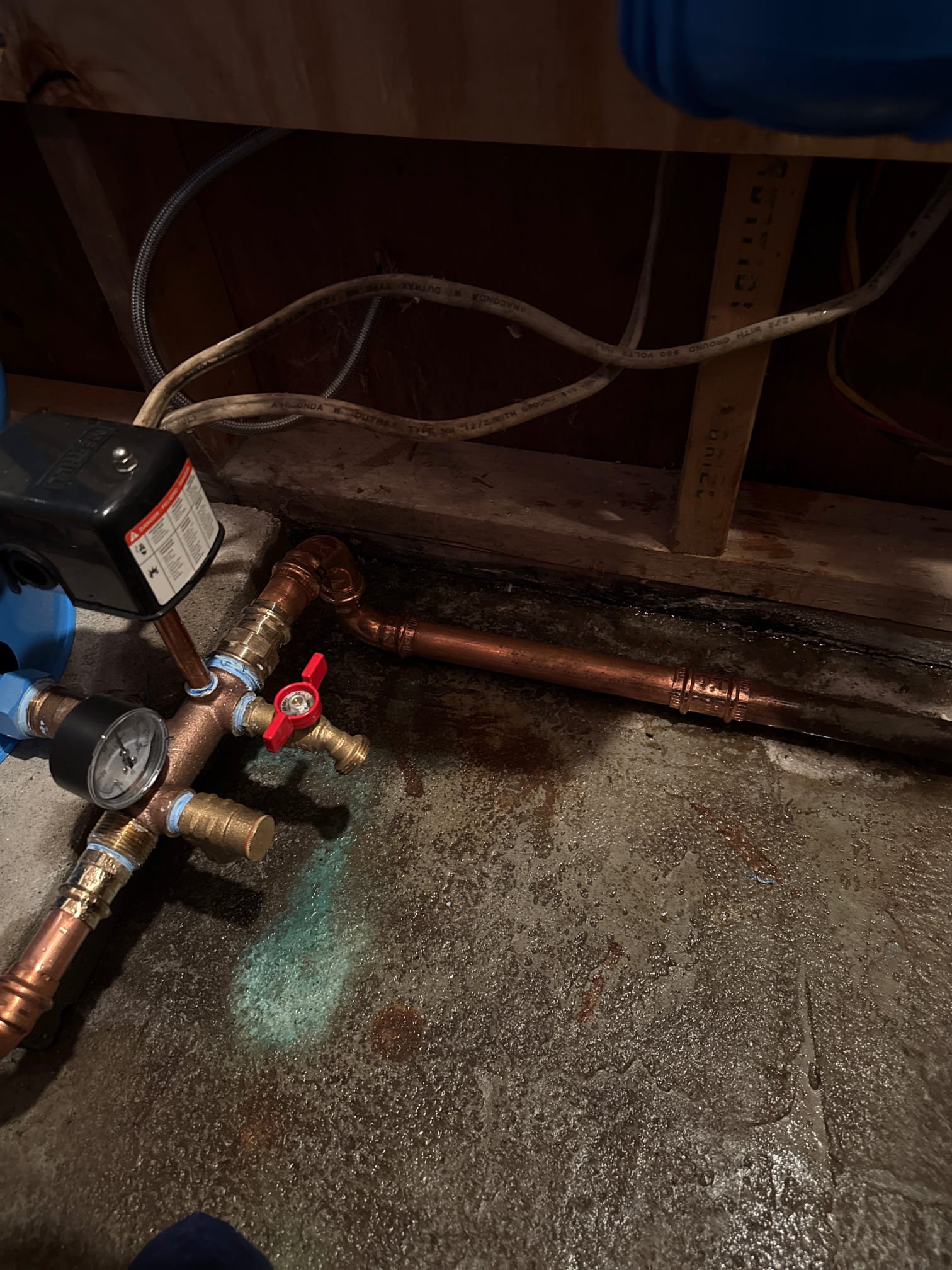 Upon arrival customer did not have water. Water would kick on intermittently. Techs tested the switch. There was 240 on the line and nothing on the load. 

We replaced the switch and found it did not give the customer water. We then tested continuity and found there was no continuity to the pump. I then removed the control box to continue diagnosis. While there was no box water kicked back on. We reviewed the history in the guest house and found that there was no check valve before the replacement of their pressure tank. We removed the check valve and kicked the pump back on. We found that this restored water to the main house. Houses are fed from the same pump and the pressure tank was abandoned in the main house. 

I ensured the abandoned pressure tank was shut off and the wires to the control box were capped off and the breaker was shut off. 

Water is restored. No charge due to issue stemming from the pressure tank install.