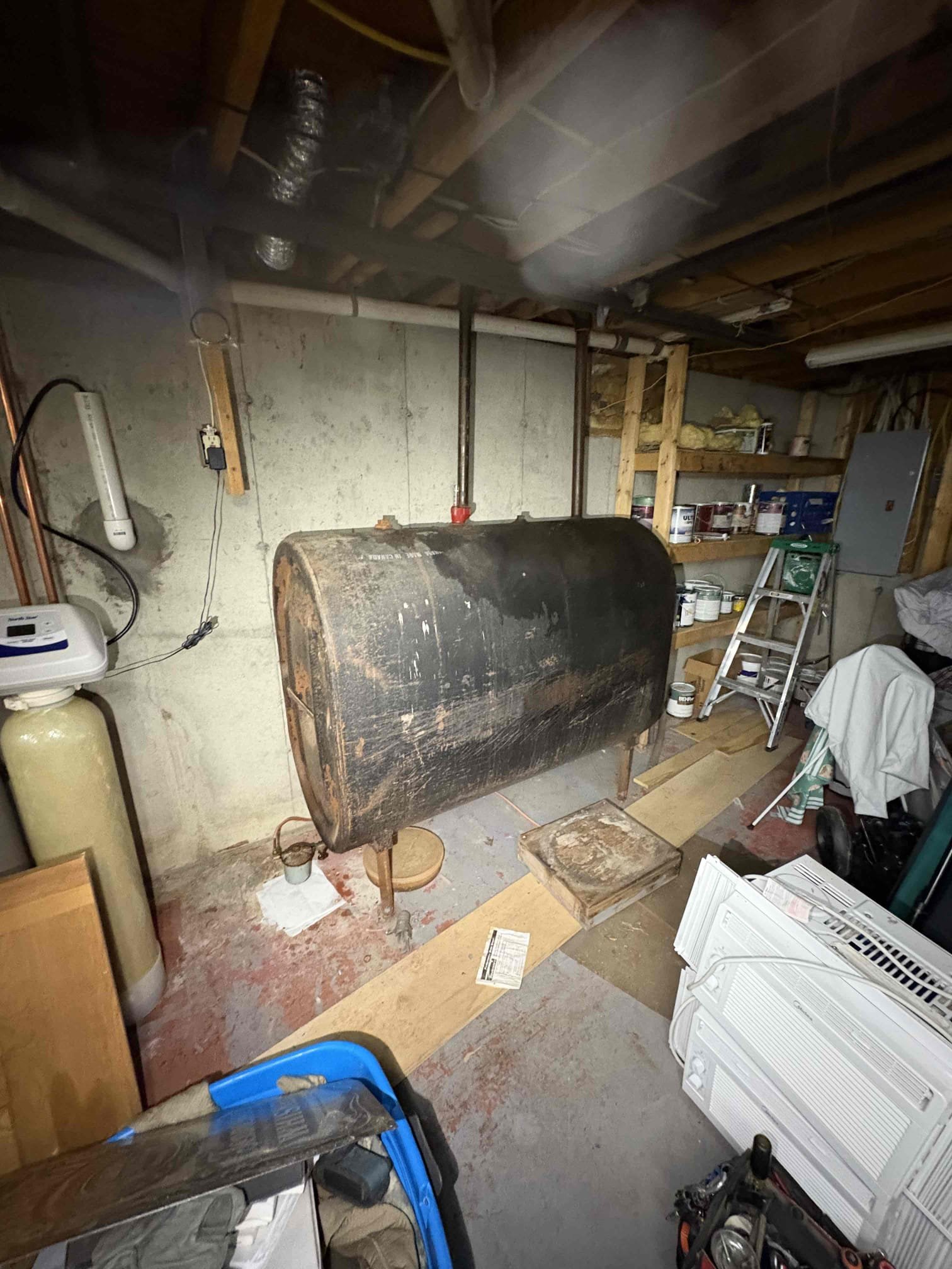 Performed annual maintenance on a Peerless oil boiler. Upon arrival, multiple failed and deteriorated components were identified, including a failed expansion tank, failed Hy-Vents, a suspected failed mixing valve, and several heavily corroded fittings and valves. After removing the boiler jacket panels, significant soot accumulation was found on the insulation and between the boiler sections. A specific source of flue gas leakage could not be identified.

The system was installed in 1989 and exhibits extensive signs of age and deterioration. Due to the poor condition of the existing valves and drains, hydronic repairs or component replacements cannot be performed reliably at this time. Based on the overall condition of the system, full boiler replacement is strongly recommended as soon as possible. While the boiler appears to be operating safely at present, the amount of required updates combined with soot accumulation inside the jacket make replacement the only practical long-term op