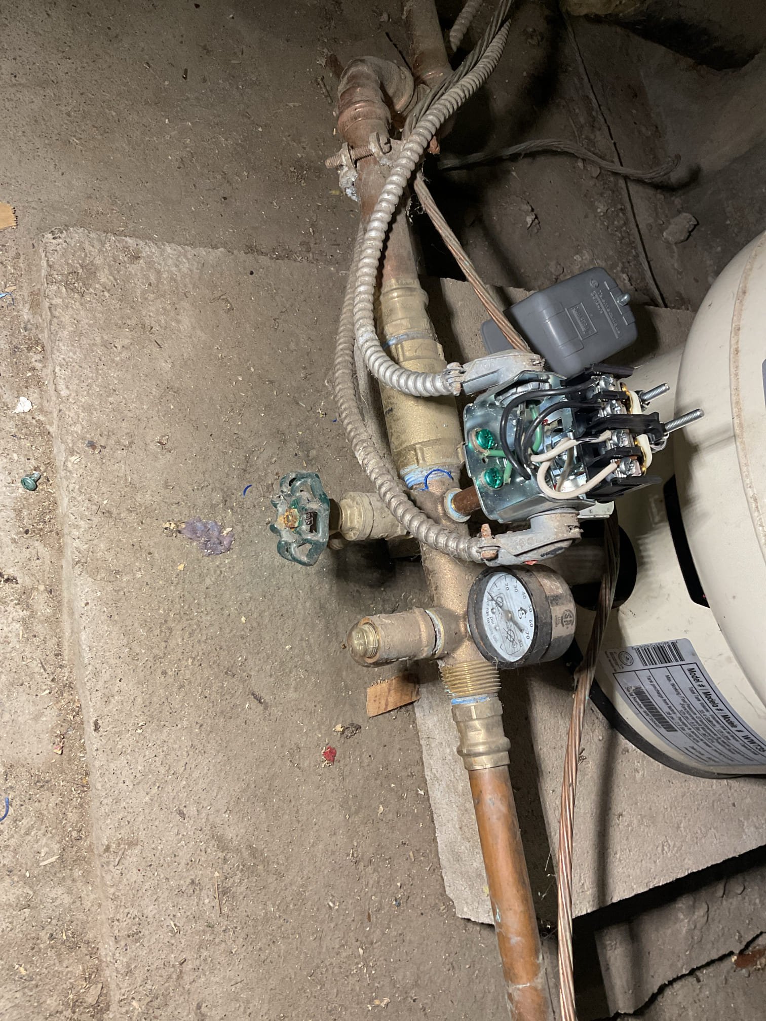 We found the property was experiencing a complete loss of water service with an unknown cause upon arrival. A full well system diagnostic was performed, which revealed the circuit breaker tripped on startup and the breaker produced a loud humming noise consistent with pump failure.

We confirmed the pressure switch was operating properly with 240V present on all terminals and adjusted the pressure tank air charge from 35 PSI to 38 PSI. The control box was removed and inspected, where a failed capacitor was found; a temporary replacement ¾ HP control box and additional capacitor were installed for testing with no change in system operation. Continuity testing confirmed wiring was intact, however pump ohm readings showed abnormal values—yellow/black reading slightly high and red/yellow significantly out of range—confirming internal pump failure.

Based on these findings, we determined the well pump has failed and is the cause of the no-water condition. Replacement of the well pump and ch