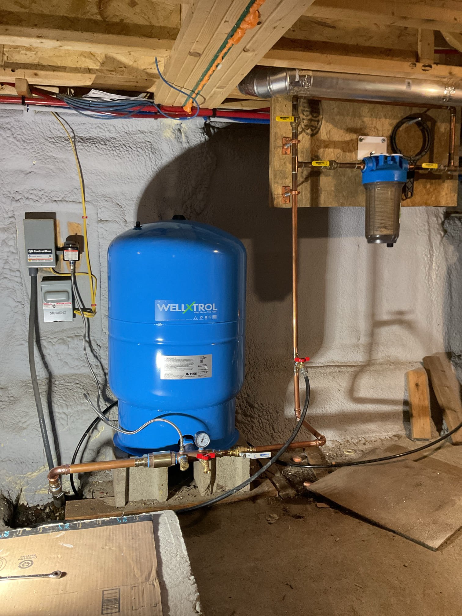 Upon arrival customer had no water coming from the Watts intelliflow washer machine valve. Upon consulting with tech support along with performing a diagnostic test I found that the timer was bad. Customer ordered a new one and will replace themselves. 

Tech also found that the customer had an unplugged softener that had not been on or serviced in the whole five years of occupancy. I proceeded to take water sample from the raw and treated side of the system to determine if the system is even necessary. While running the water I noticed water pulsing. I checked at the pressure tank and found that the pressure tank was waterlogged and short cycling. 

I removed and disposed of the waterlogged pressure tank and installed a new 44 gallon pressure tank, a tank tee, new pressure switch, new main shutoff valve, and a boiler drain after all this to give the house increased serviceability in the water lines and fixtures. 

I turned the water back on and found no leaks present and the system wa