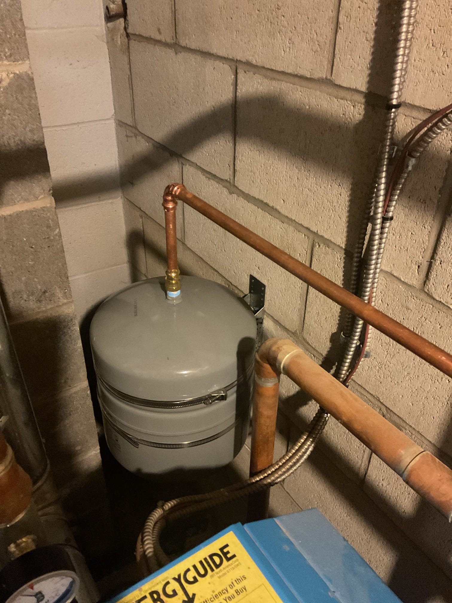 The boiler supply was re-piped to include a main air elimination device, and the failed expansion tank was relocated to the wall adjacent to the boiler. This work was completed to address the air entrapment occurring in the water heater zone and to reduce air-related issues throughout the system. Upon completion, all heating zones were verified to be circulating properly, and the system was purged to ensure all air was removed. 