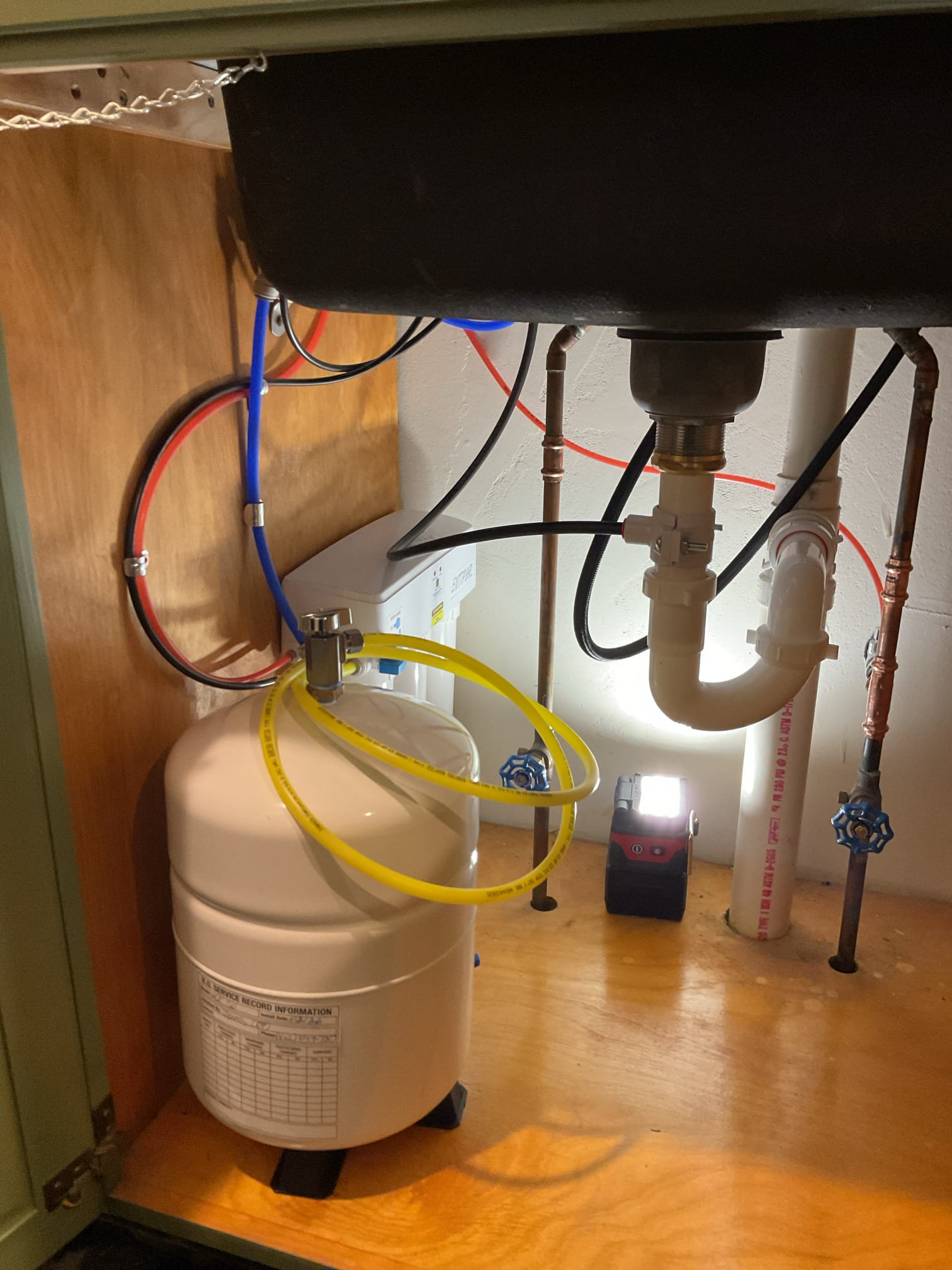 Customer needed an RO installed to remove potassium and sodium. Upon arrival I shut the water off to the faucet and added a tee with a 1/4” stop valve and hooked it to the supply.

I then drilled out a hole in the sink and used it to mount the RO faucet. I then hooked up the faucet supply and ran the discharge and drain line to the faucet and hooked it up to the tailpipe of the sink trap to give it a place to drain and give it an air gap. 

I then hooked the RO to the holding tank and installed a stop shutoff valve on the holding tank. 

I proceeded to flush the filters and go through the start up procedure of the system. Everything is working well with no leaks present at time of service. I have attached a link to the ELP50 filters. 





https://represcott.com/products/replacement-cartridge-kit-for-elp50-ro-units?_pos=1&_sid=3763a36e9&_ss=r