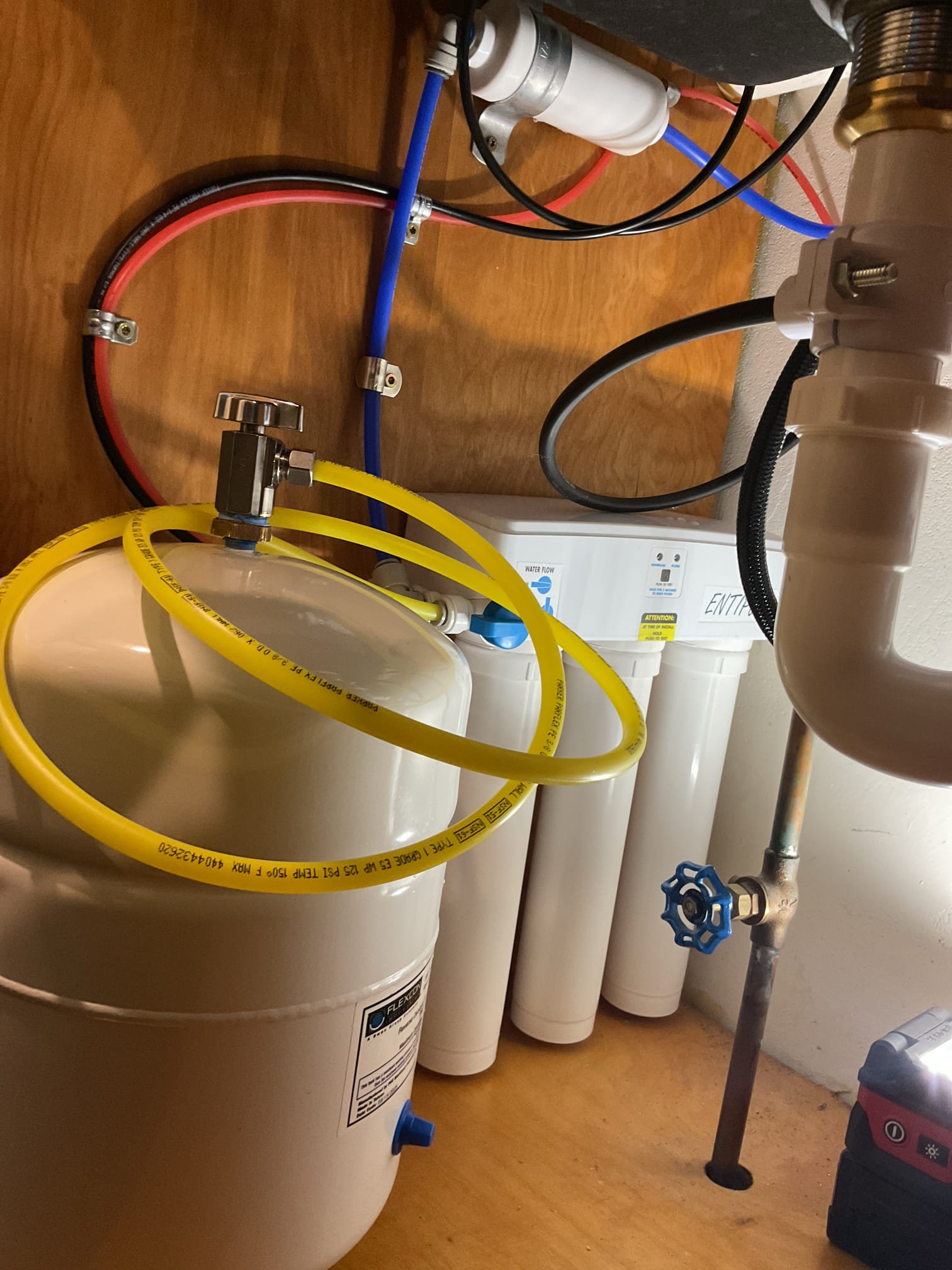 Customer needed an RO installed to remove potassium and sodium. Upon arrival I shut the water off to the faucet and added a tee with a 1/4” stop valve and hooked it to the supply.

I then drilled out a hole in the sink and used it to mount the RO faucet. I then hooked up the faucet supply and ran the discharge and drain line to the faucet and hooked it up to the tailpipe of the sink trap to give it a place to drain and give it an air gap. 

I then hooked the RO to the holding tank and installed a stop shutoff valve on the holding tank. 

I proceeded to flush the filters and go through the start up procedure of the system. Everything is working well with no leaks present at time of service. I have attached a link to the ELP50 filters. 





https://represcott.com/products/replacement-cartridge-kit-for-elp50-ro-units?_pos=1&_sid=3763a36e9&_ss=r