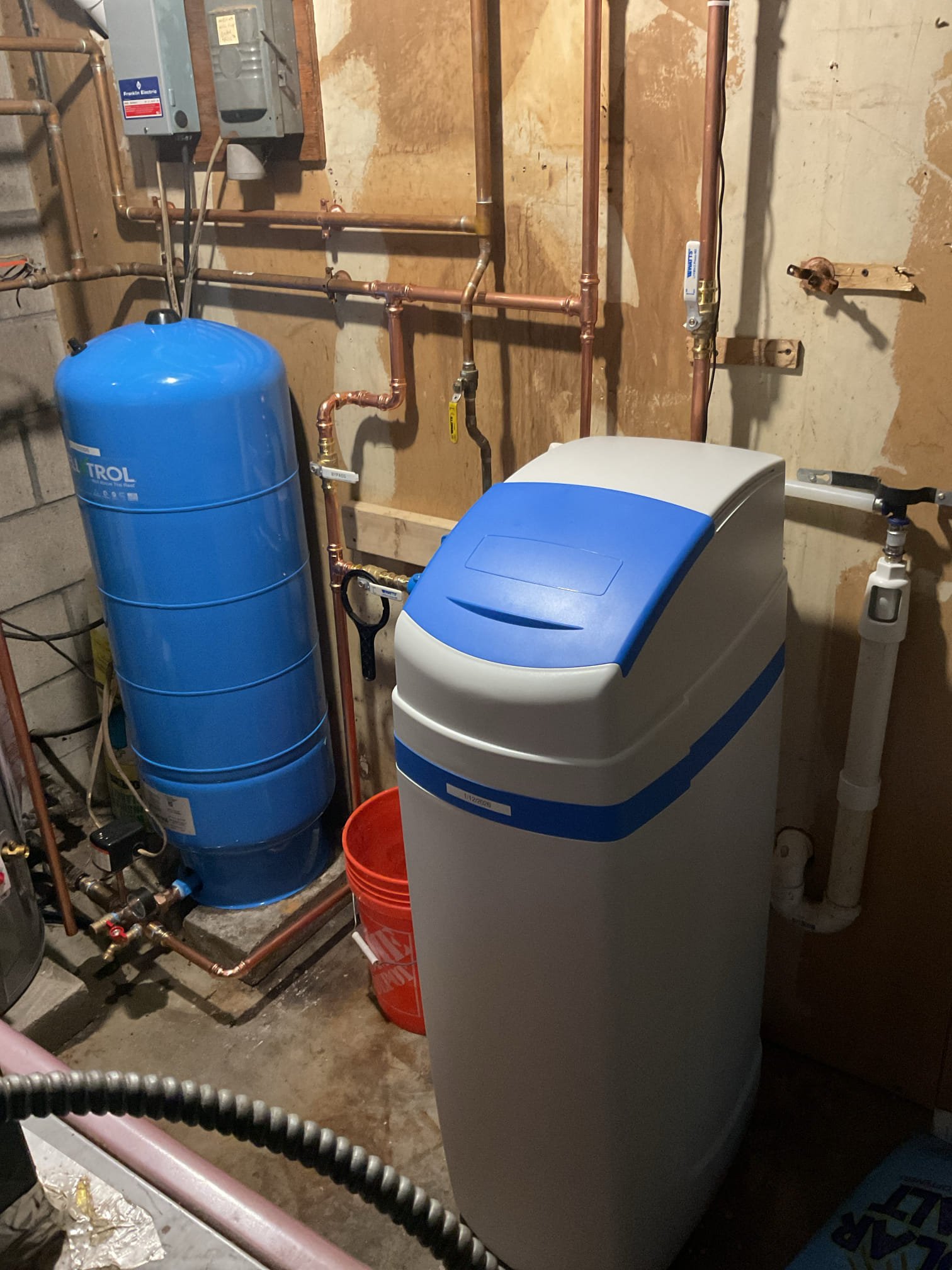 The existing well pressure tank, water filter housing, and water softener were removed due to age, improper operation, and signs of system failure. These components were no longer functioning reliably and required replacement to restore proper water system performance.

A new well pressure tank, new water filter housing, and a cabinet-style water softener were professionally installed. The water softener was programmed and calibrated according to the results of a previously collected water sample to ensure optimal treatment performance.

Upon completion of installation, the entire water system was thoroughly tested. All components were verified to be operating correctly, with proper pressure, flow, and water treatment function confirmed at the time of service.