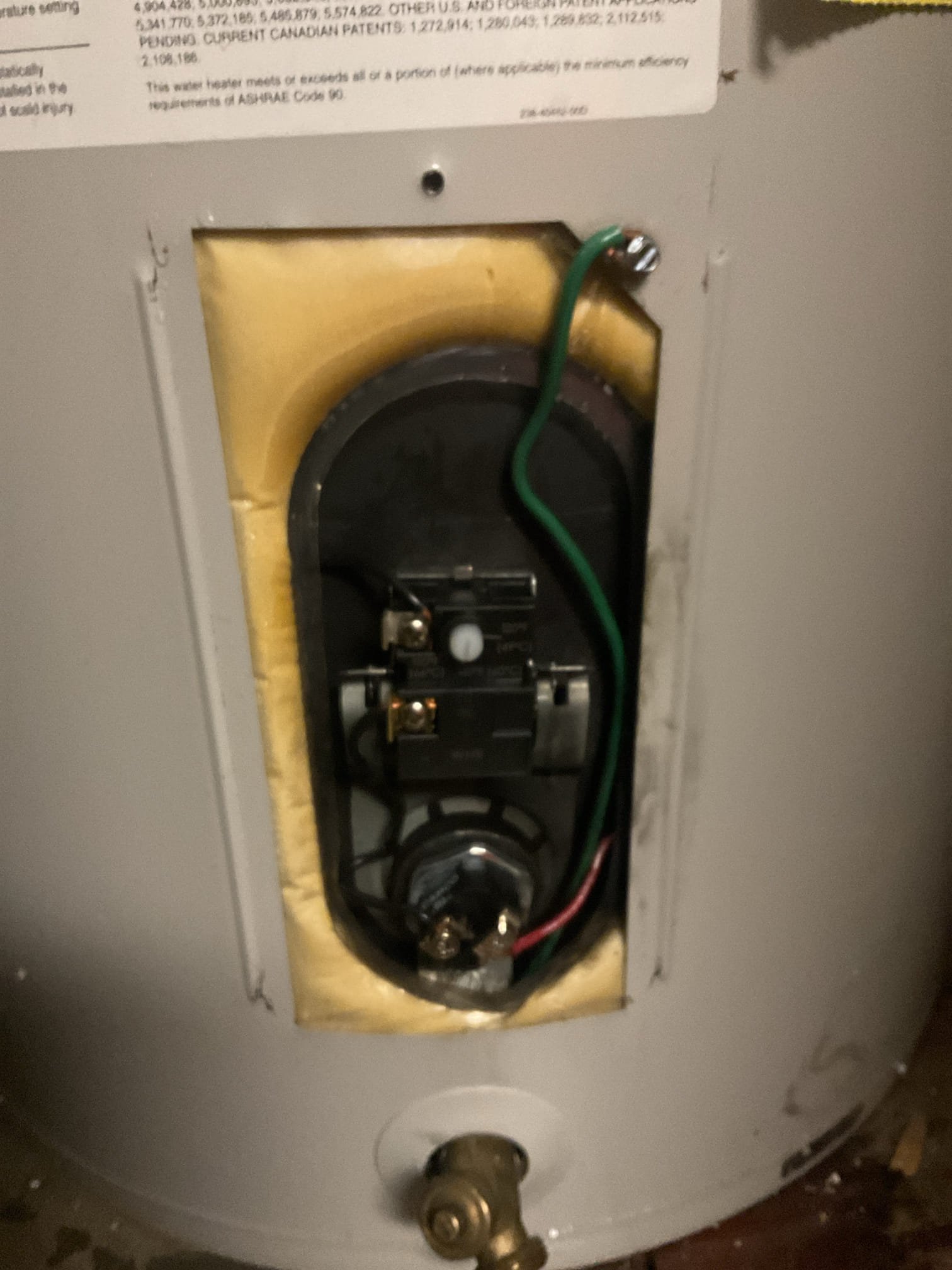 The homeowner reported a loss of hot water following a recent replacement of the lower heating element. Upon arrival, we found the safety reset on the upper thermostat had tripped, indicating a likely failure of the upper heating element and weakened thermostats. We recommended a full thermostat rebuild, including replacement of the remaining heating element and both thermostats, to restore efficient operation, improve performance, and extend the service life of the water heater.

Water was shut off and the tank was drained below the upper element to complete the repairs. The upper element was found to be heavily coated with calcium buildup, which likely contributed to the failure. Both upper and lower thermostats were replaced, the unit was refilled, air was purged from the system, and power was restored. Proper operation was confirmed with the upper element heating and warm water verified at the fixture prior to departure.