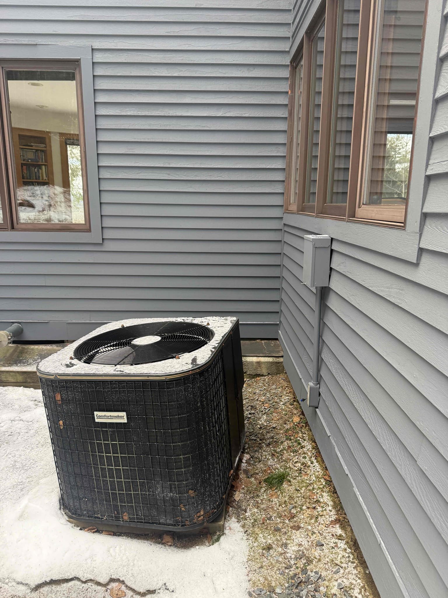 Disconnected the existing air conditioning unit from the residence to allow for homeowner removal. Verified the condenser contained 0 PSI and no refrigerant. Cut and crimped the copper line sets to properly seal the system, disconnected the electrical whip, and left the electrical disconnect in place on the house. De-energized the circuit by shutting off the breaker supplying the outdoor disconnect, and disconnected and secured the thermostat control wires with wire nuts.