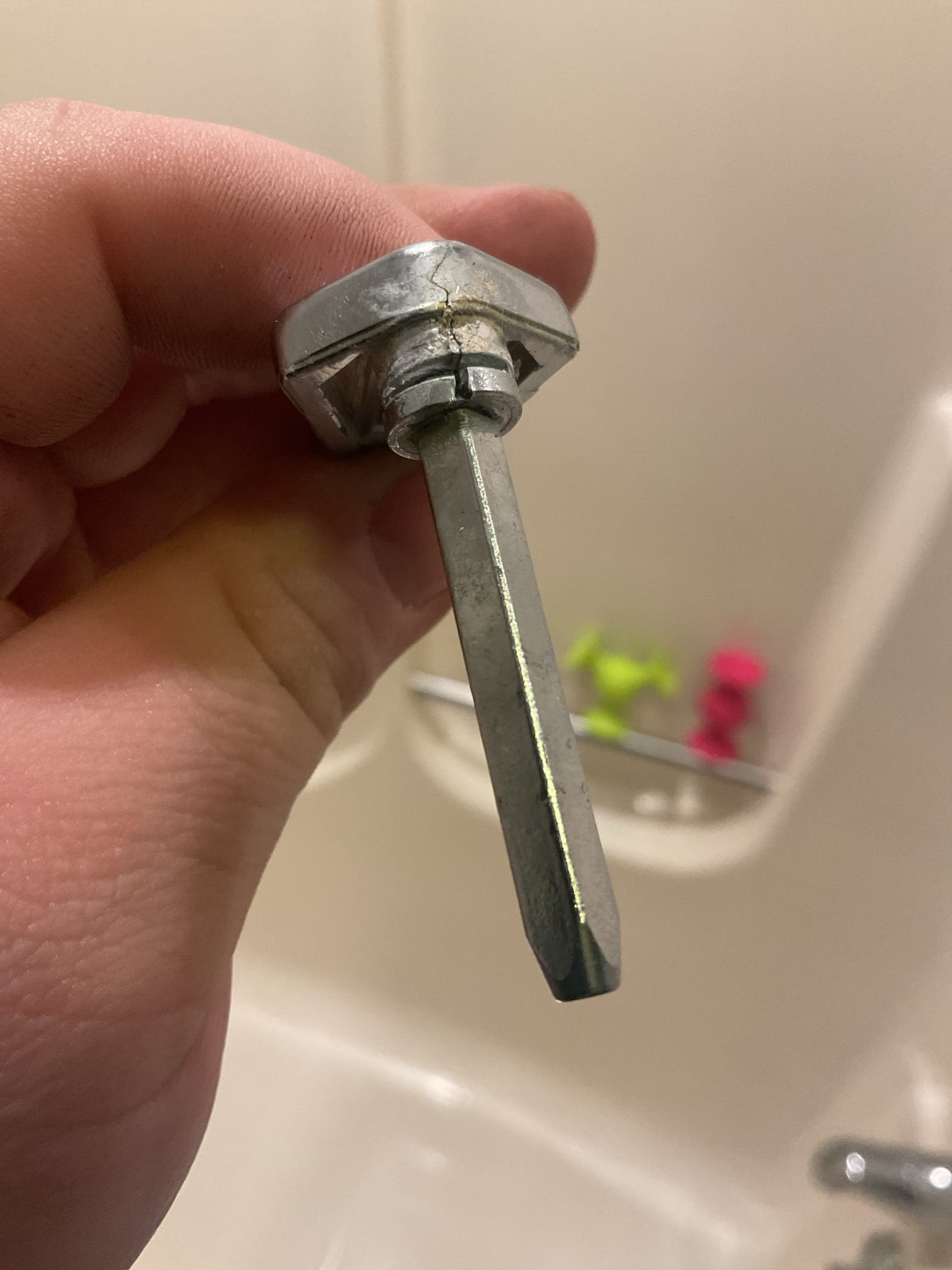 Upon arrival, an active water leak was observed occurring through deteriorated grout lines during shower use. As a temporary corrective measure, silicone was applied to the failing grout areas to help mitigate water intrusion.

A full evaluation of the guest bathroom shower was then performed due to reported operational issues. The shower was not properly diverting water from the tub spout to the shower head and exhibited low water flow. Further diagnosis determined that the Symmons cartridge and diverter handle had failed.

The failed cartridge and diverter handle were removed and replaced, restoring proper diversion, water flow, and overall shower operation. The shower was tested after repairs were completed and confirmed to be functioning as designed at the time of service.

