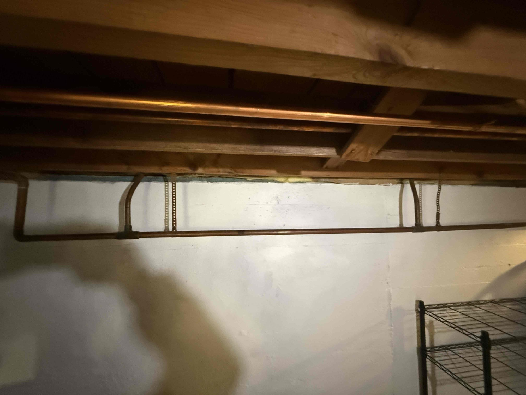 Living room radiator removed and a temporary bypass line installed to maintain heat to the first floor. Shutoff valves were added for future reinstallation. An estimate to reinstall the radiator will be provided once wall repairs are completed. We purged zone and drained out inhibitor that was previously put into system.