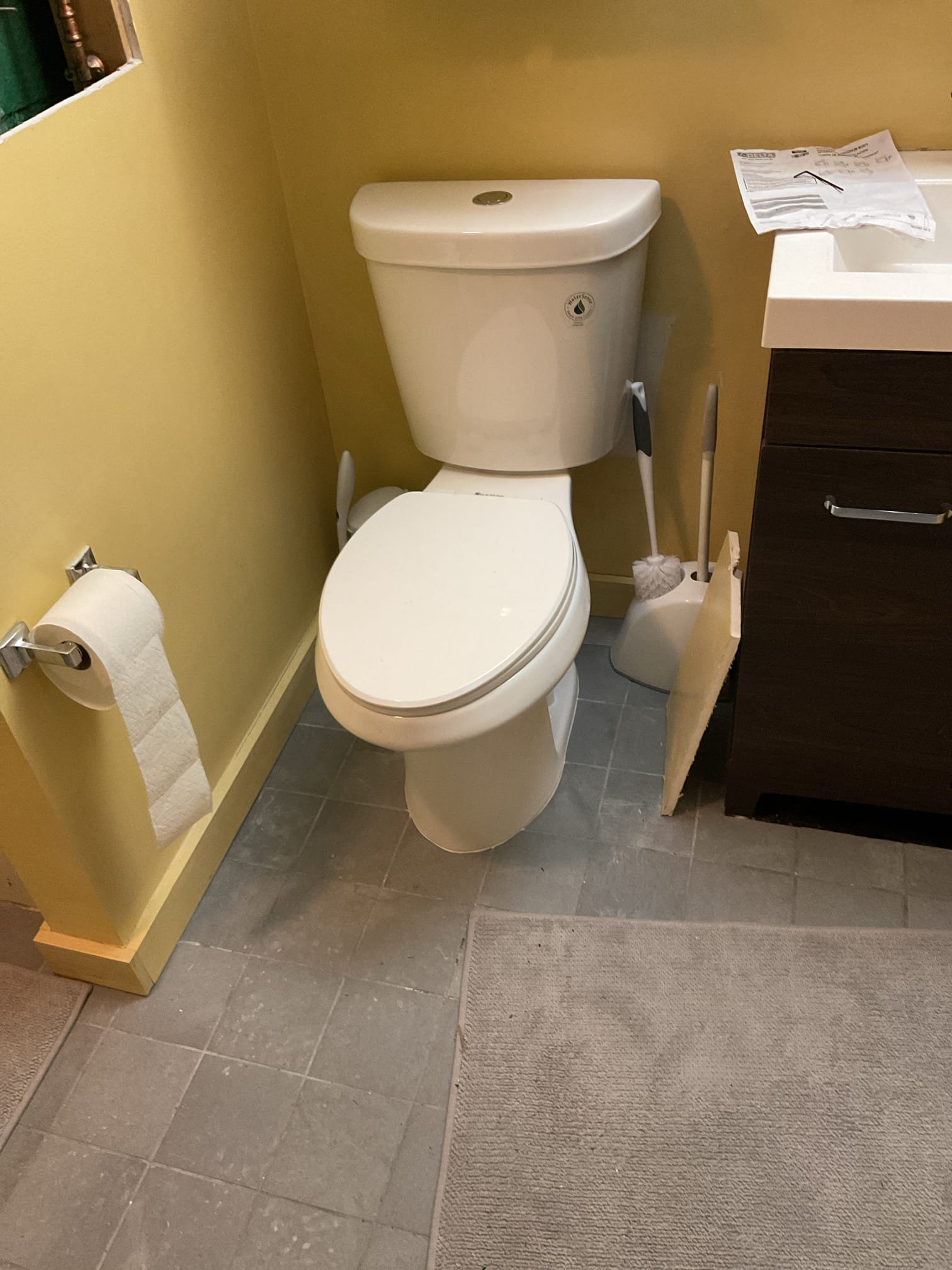 Upon arrival, the water supply was restored and air was purged from all hot and cold fixtures. System pressure was checked and found to exceed 100 PSI due to a failed pressure reducing valve. The faulty valve was removed and replaced with a new unit, and proper operation was verified with system pressure set to 60 PSI. All valves were opened and each fixture was inspected to confirm normal operation with no leaks present. The upstairs right bathroom toilet was also tested and showed no leaks; a bead of caulking was applied around the base to improve stability and ease of cleaning.

The upstairs toilet was found to be unstable due to movement at the base and age-related wear. The existing toilet was removed, and inspection revealed that a proper metal flange was not present and the toilet had been secured only with screws. Tile was carefully removed to allow for proper flange installation. A new metal flange was installed and secured to the floor, with a spacer added to ensure correct h