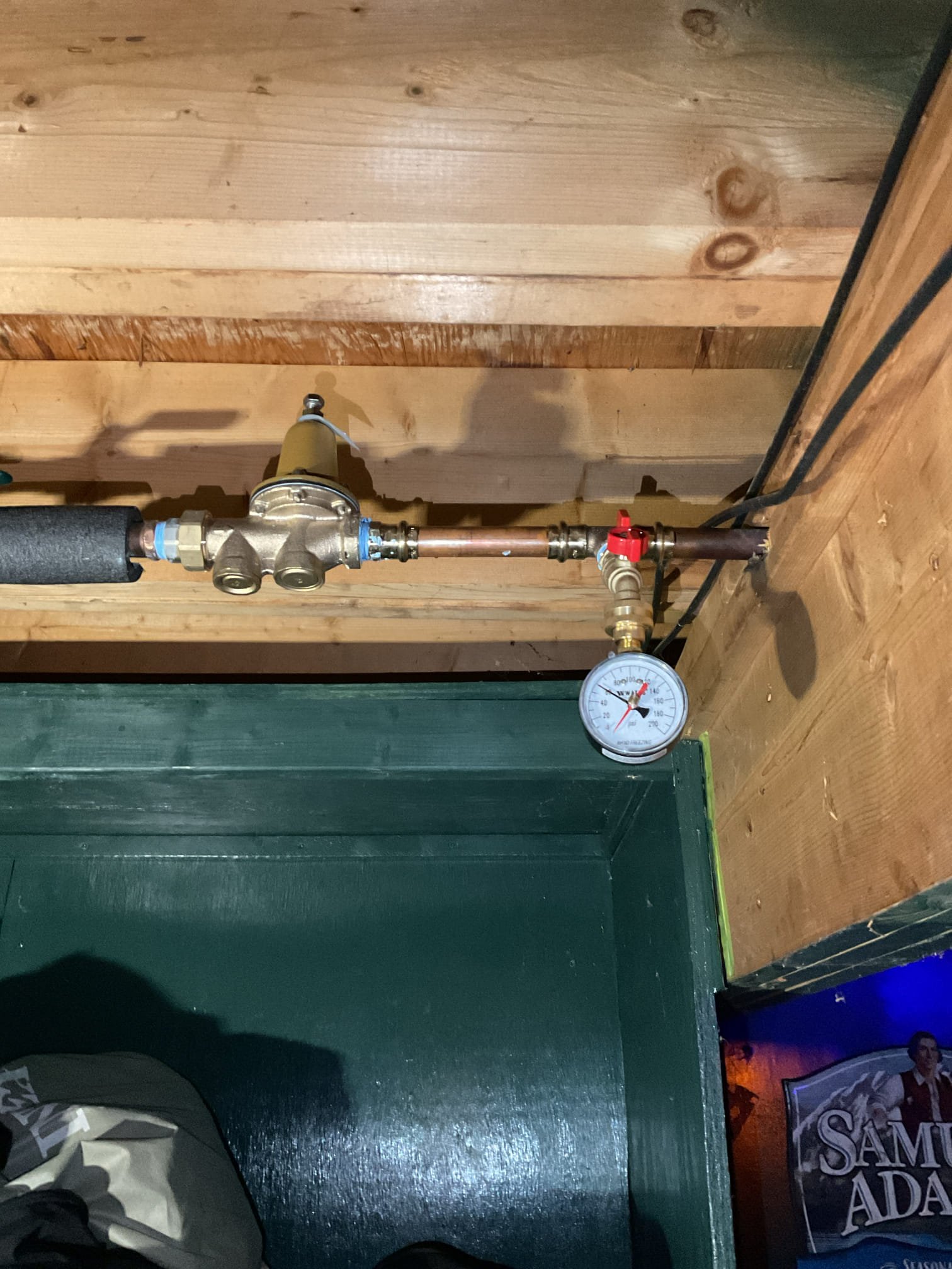 Upon arrival, the water supply was restored and air was purged from all hot and cold fixtures. System pressure was checked and found to exceed 100 PSI due to a failed pressure reducing valve. The faulty valve was removed and replaced with a new unit, and proper operation was verified with system pressure set to 60 PSI. All valves were opened and each fixture was inspected to confirm normal operation with no leaks present. The upstairs right bathroom toilet was also tested and showed no leaks; a bead of caulking was applied around the base to improve stability and ease of cleaning.

The upstairs toilet was found to be unstable due to movement at the base and age-related wear. The existing toilet was removed, and inspection revealed that a proper metal flange was not present and the toilet had been secured only with screws. Tile was carefully removed to allow for proper flange installation. A new metal flange was installed and secured to the floor, with a spacer added to ensure correct h