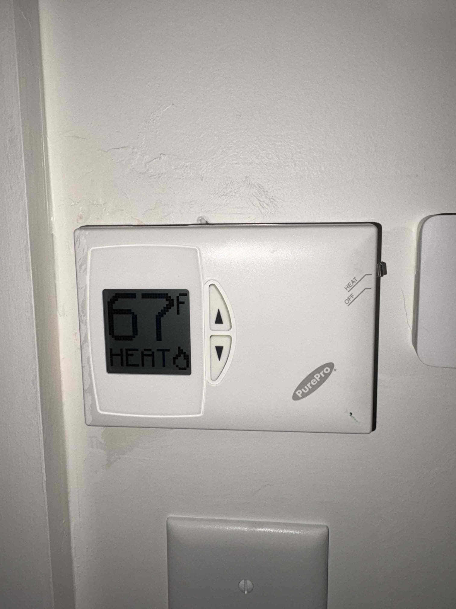 Responded to a report of a newly installed Peerless oil boiler not heating the home above 60°F.

Upon arrival, I confirmed proper operation of all three thermostats and began verifying system circulation. All supply and return piping at the boiler was hot; however, I identified multiple split loops within each zone and found three sections that were air-locked. The system was purged at the manifold and individually at each baseboard bleeder. After purging, I confirmed that all baseboard sections were hot and circulating properly. At this time, the boiler and all associated components are operating as designed.

The kitchen area is currently equipped with only one section of baseboard, located to the right of the front door. This single section is insufficient to adequately heat the combined kitchen and dining area, especially considering the loft space and open cathedral ceiling above. This issue is further compounded by seating and cabinetry obstructing proper airflow through the base