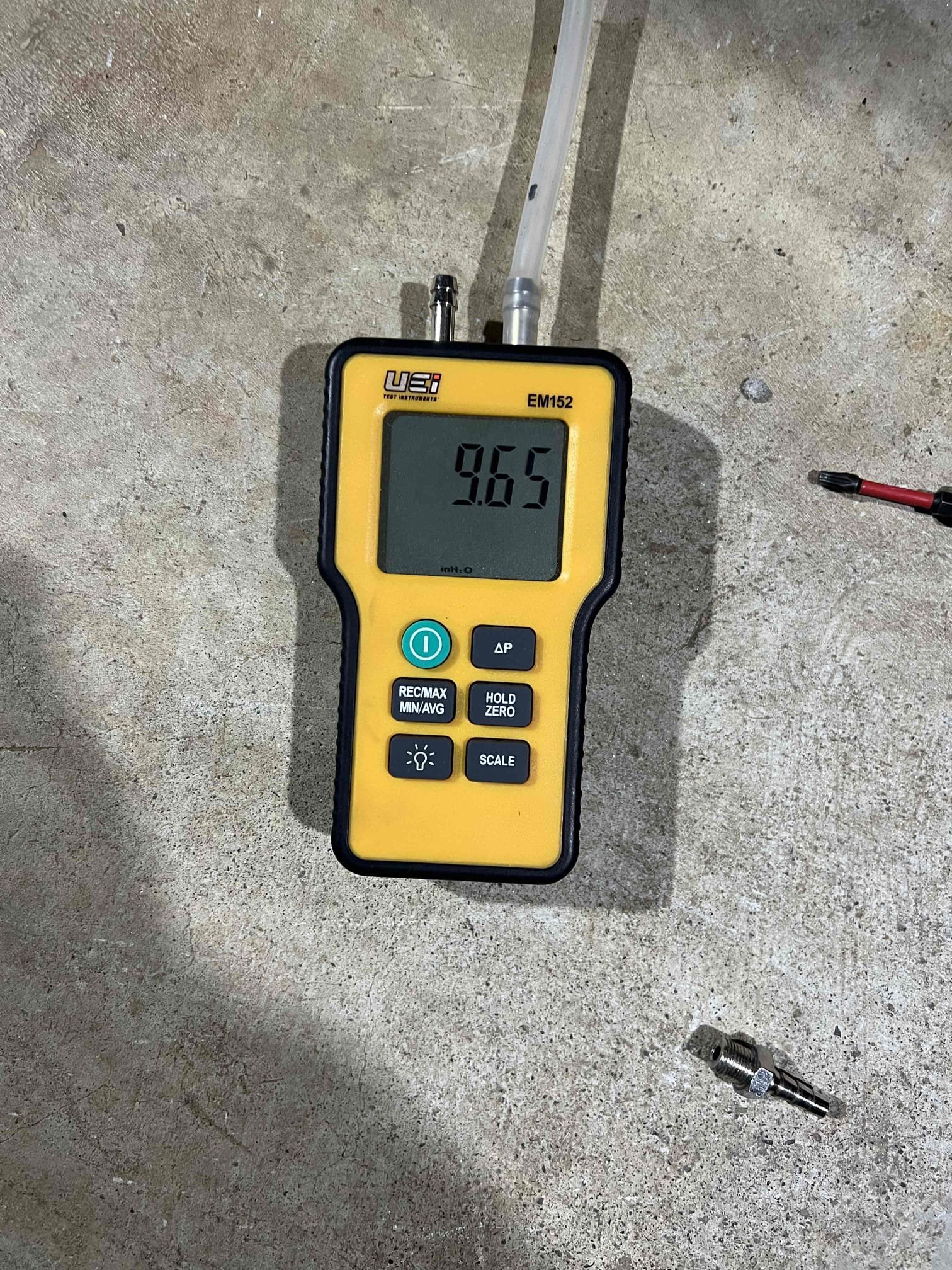 Arrived on site to investigate a no–hot water issue on a Rheem natural-draft propane water heater, installed by us in December 2025. Upon inspection, we found the combustion air safety had tripped and the burner and burner orifice were sooted. We contacted technical support, who had us verify the manifold gas pressure, which was within manufacturer specifications.

This water heater is common-vented into the chimney with a propane boiler. Based on their findings, technical support recommended reworking the venting. They are sending a replacement combustion air safety directly to the customer. We will verify local venting codes and make any necessary vent modifications once confirmed.